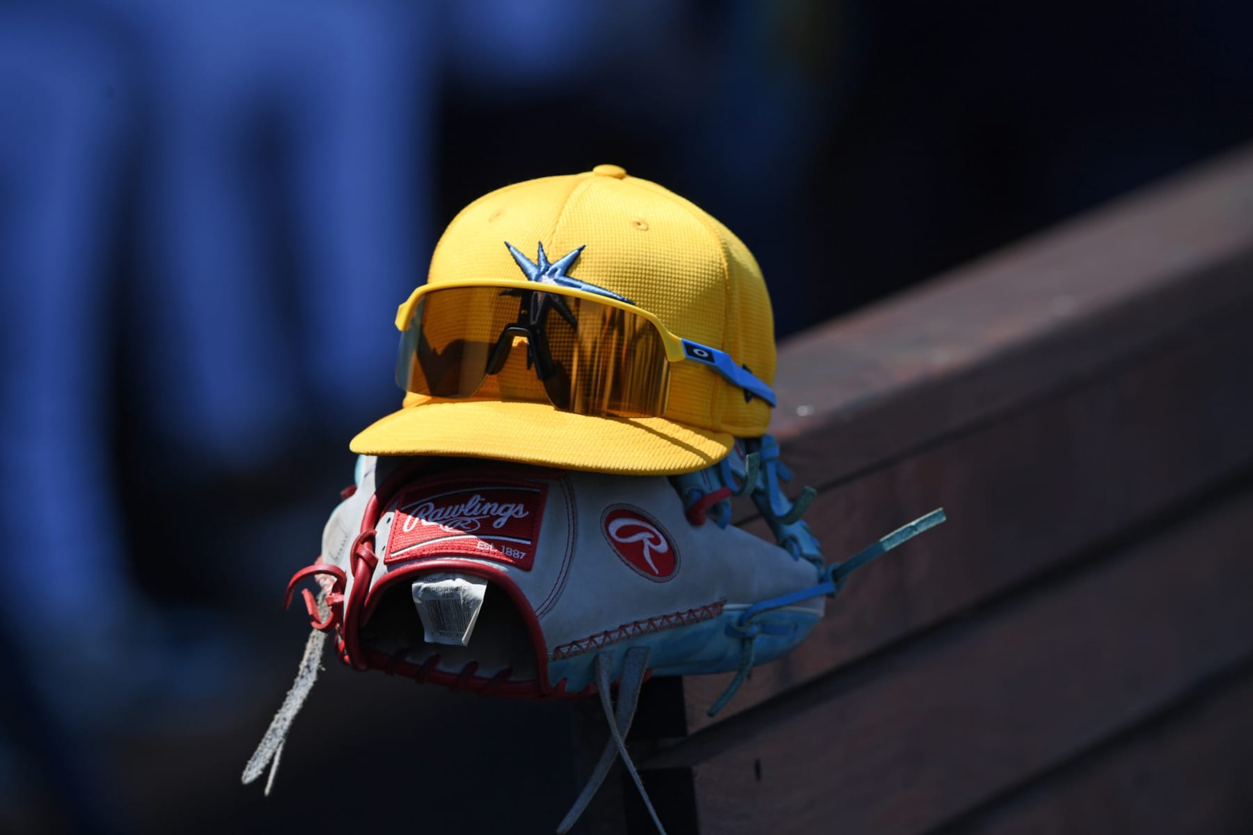 PORT CHARLOTTE, FLORIDA - MARCH 18, 2024: A view of a Tampa Bay Rays glove and hat during the second inning of a spring training game against the Atlanta Braves at Charlotte Sports Park on March 18, 2024 in Port Charlotte, Florida. (Photo by George Kubas/Diamond Images via Getty Images) PORT CHARLOTTE, FLORIDA - MARCH 18, 2024: A view of a Tampa Bay Rays glove and hat during the second inning of a spring training game against the Atlanta Braves at Charlotte Sports Park on March 18, 2024 in Port Charlotte, Florida. (Photo by George Kubas/Diamond Images via Getty Images)