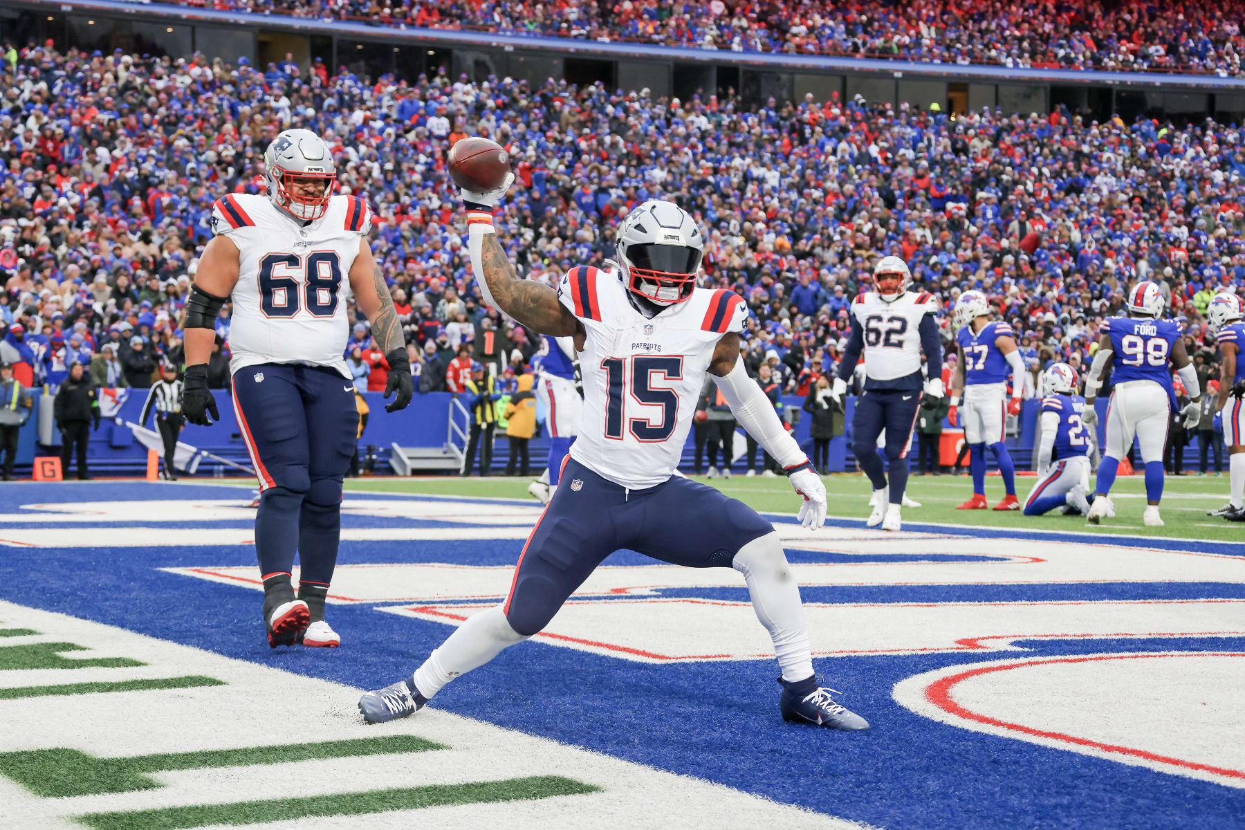 ORCHARD PARK, NEW YORK - DECEMBER 31: Ezekiel Elliott #15 of the New England Patriots celebrates a touchdown during the fourth quarter of a game against the Buffalo Bills at Highmark Stadium on December 31, 2023 in Orchard Park, New York. (Photo by Timothy T Ludwig/Getty Images)