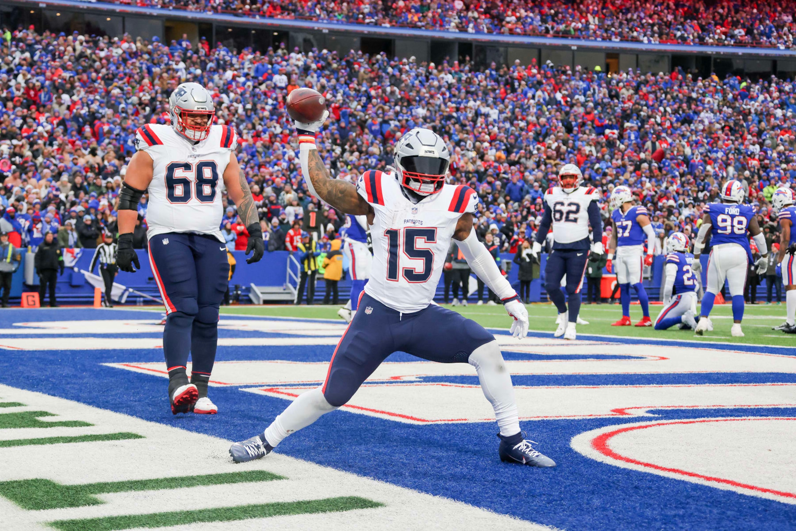 ORCHARD PARK, NEW YORK - DECEMBER 31: Ezekiel Elliott #15 of the New England Patriots celebrates a touchdown during the fourth quarter of a game against the Buffalo Bills at Highmark Stadium on December 31, 2023 in Orchard Park, New York. (Photo by Timothy T Ludwig/Getty Images)