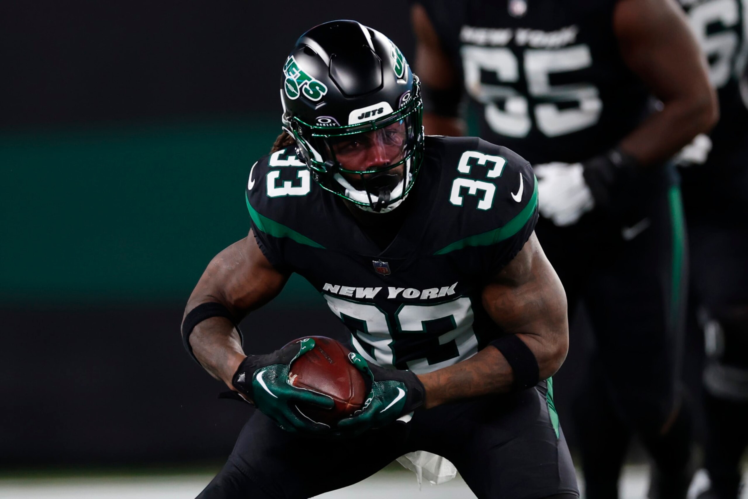 EAST RUTHERFORD, NEW JERSEY - NOVEMBER 24: Running back Dalvin Cook #33 of the New York Jets in action against the Miami Dolphins during a football game at MetLife Stadium on November 24, 2023 in East Rutherford, New Jersey. (Photo by Rich Schultz/Getty Images)