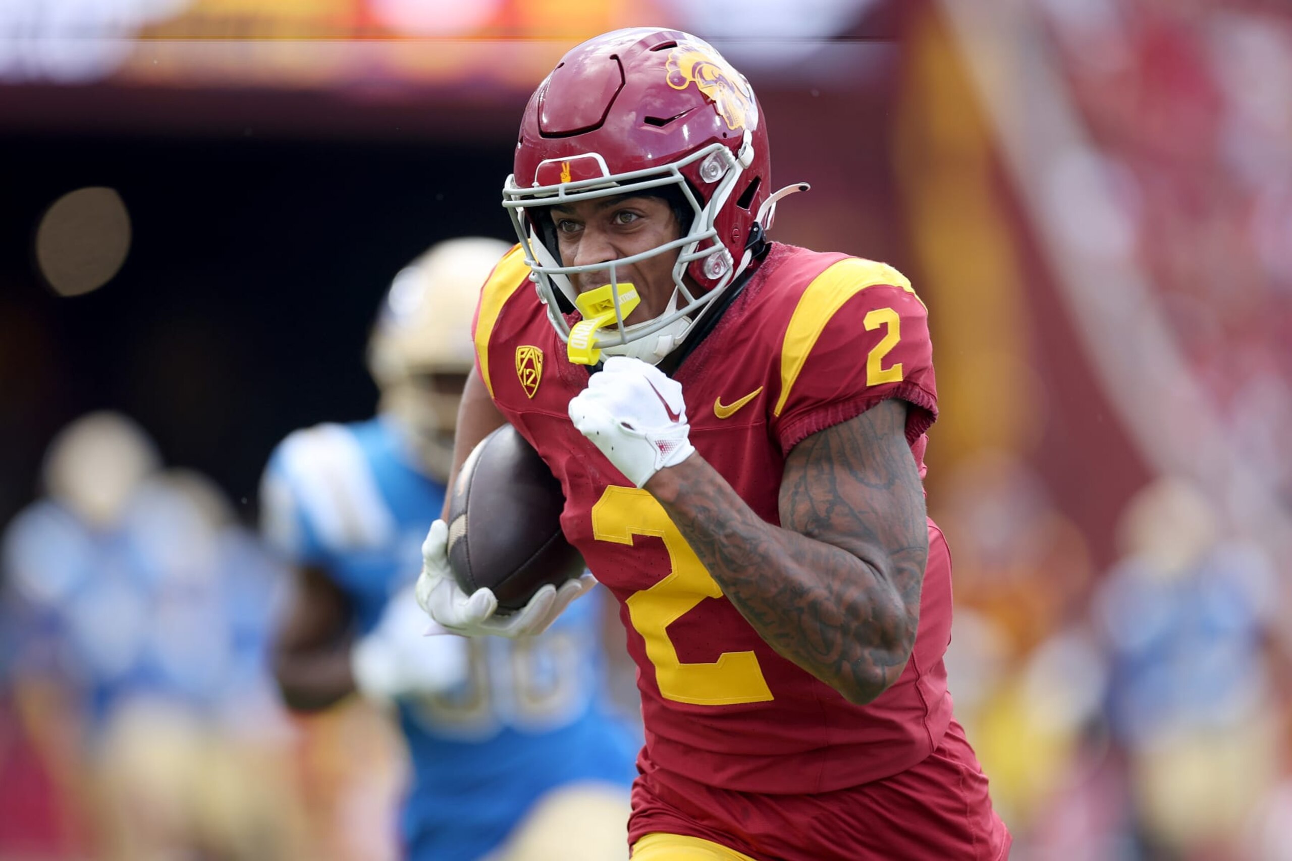LOS ANGELES, CALIFORNIA - NOVEMBER 18: Brenden Rice #2 of the USC Trojans runs the ball after a reception during the first half of a game against the UCLA Bruins at United Airlines Field at the Los Angeles Memorial Coliseum on November 18, 2023 in Los Angeles, California. (Photo by Sean M. Haffey/Getty Images)