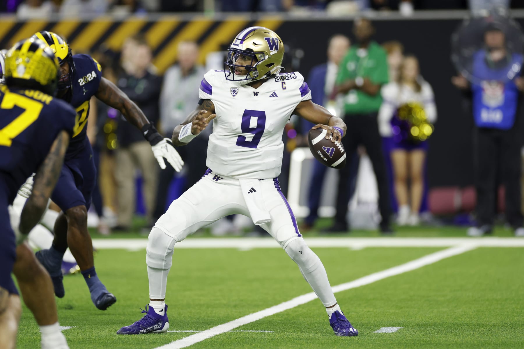 HOUSTON, TX - JANUARY 08: Washington Huskies quarterback Michael Penix Jr. (9) passes the ball during the CFP National Championship against the Michigan Wolverines on January 08, 2024 at NRG Stadium in Houston, Texas. (Photo by Joe Robbins/Icon Sportswire via Getty Images)
