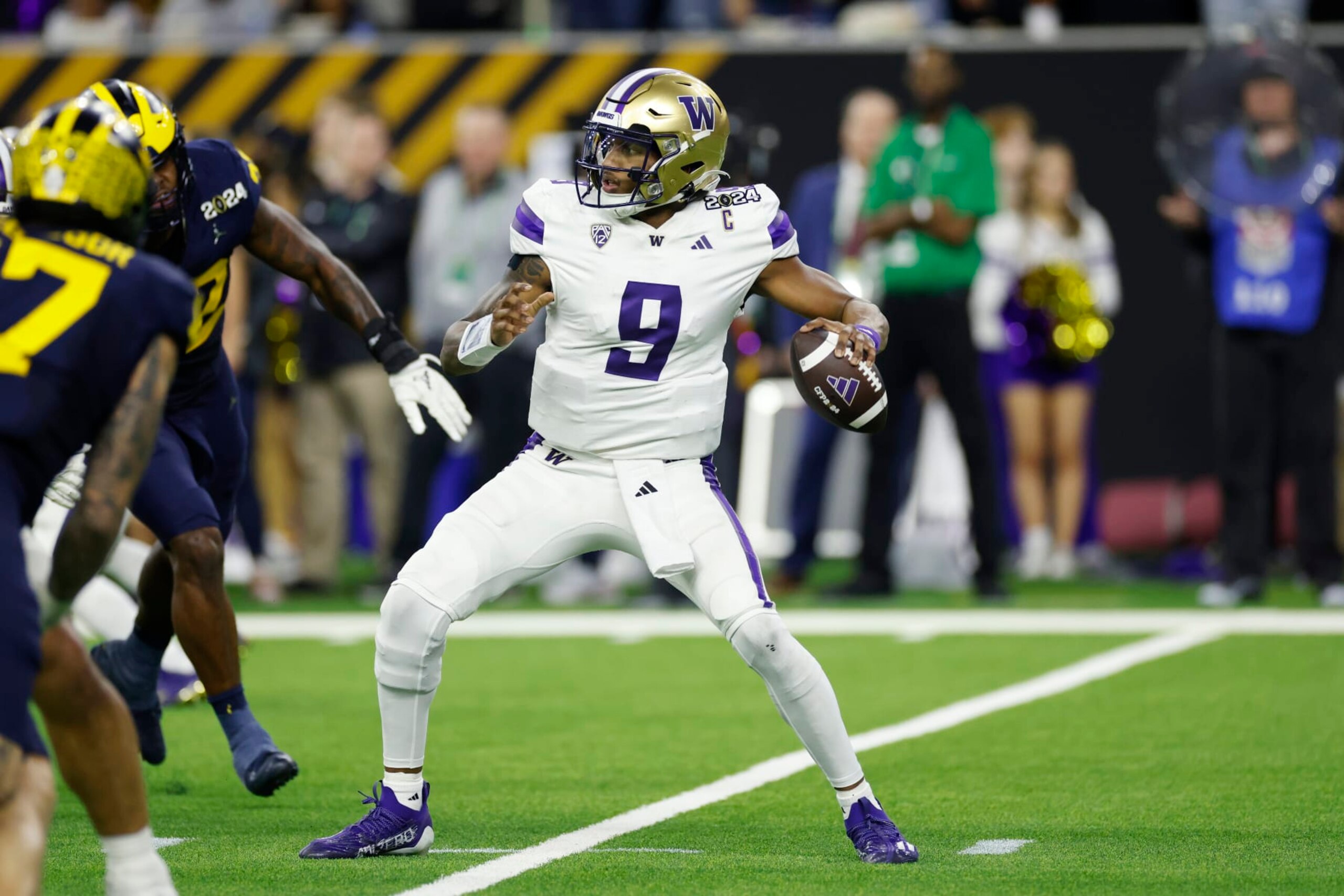 HOUSTON, TX - JANUARY 08: Washington Huskies quarterback Michael Penix Jr. (9) passes the ball during the CFP National Championship against the Michigan Wolverines on January 08, 2024 at NRG Stadium in Houston, Texas. (Photo by Joe Robbins/Icon Sportswire via Getty Images)