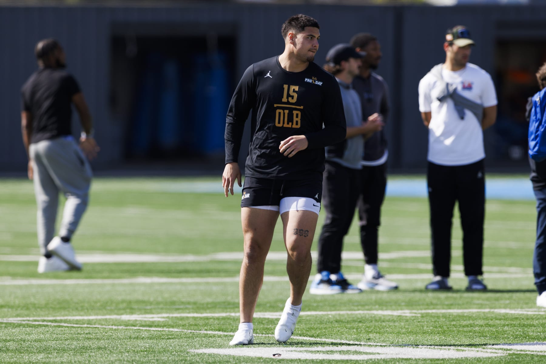 LOS ANGELES, CALIFORNIA - MARCH 15: Laiatu Latu (15) of the UCLA Bruins participates in drills at Spaulding Field at the Wasserman Football Center on March 15, 2024 in Los Angeles, California. (Photo by Ric Tapia/Getty Images)