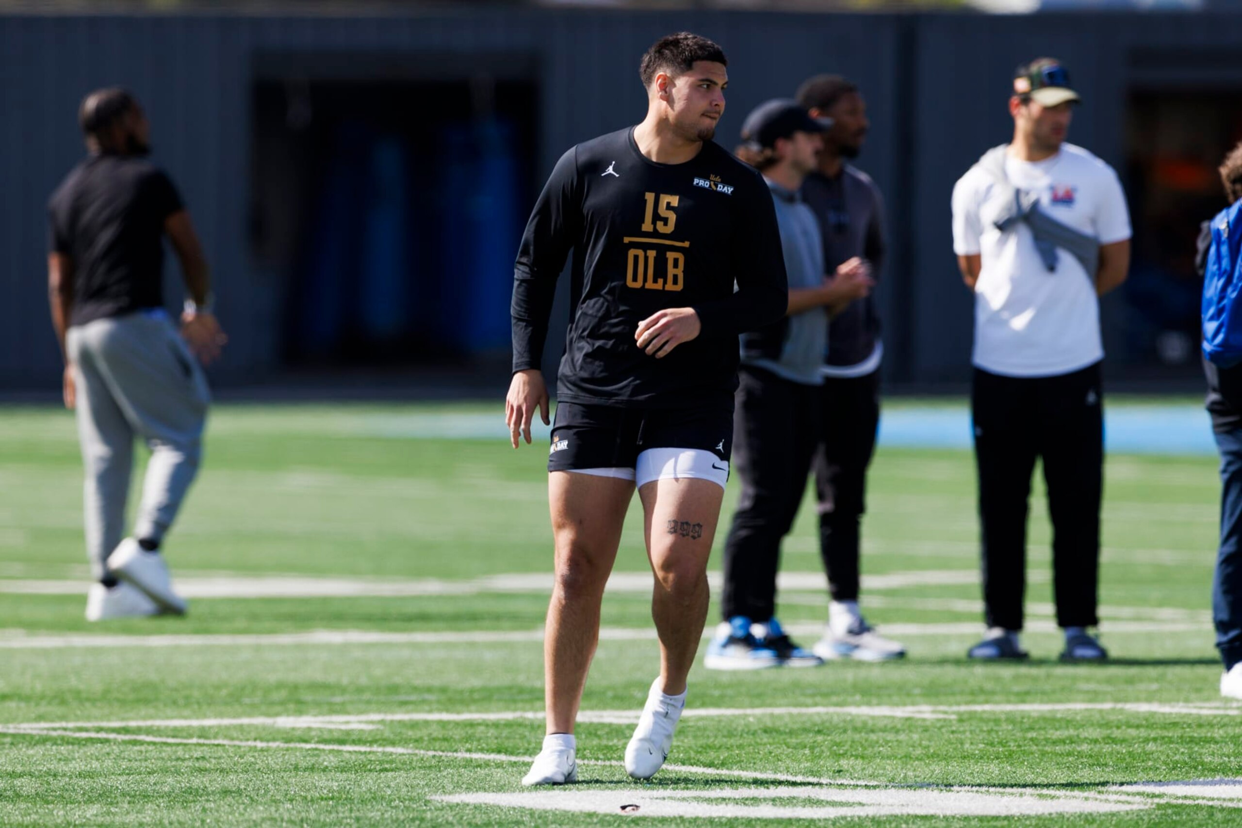 LOS ANGELES, CALIFORNIA - MARCH 15: Laiatu Latu (15) of the UCLA Bruins participates in drills at Spaulding Field at the Wasserman Football Center on March 15, 2024 in Los Angeles, California. (Photo by Ric Tapia/Getty Images)