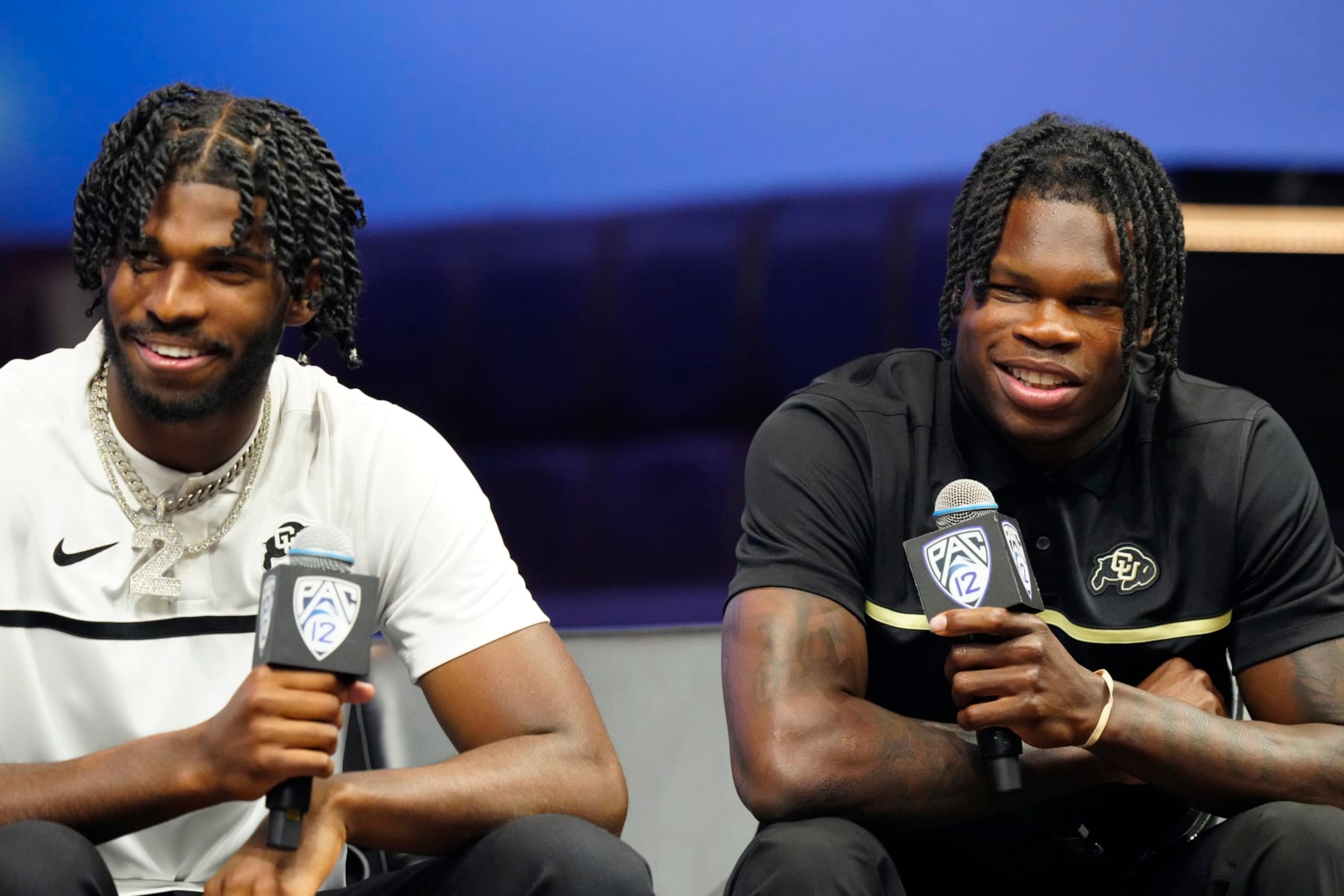LAS VEGAS, NEVADA - JULY 21: (L-R) Shedeur Sanders #2 and Travis Hunter #12 of the University of Colorado Buffaloes speak with the media at Zouk Nightclub at Resorts World Las Vegas on July 21, 2023 in Las Vegas, Nevada. (Photo by Louis Grasse/Getty Images)