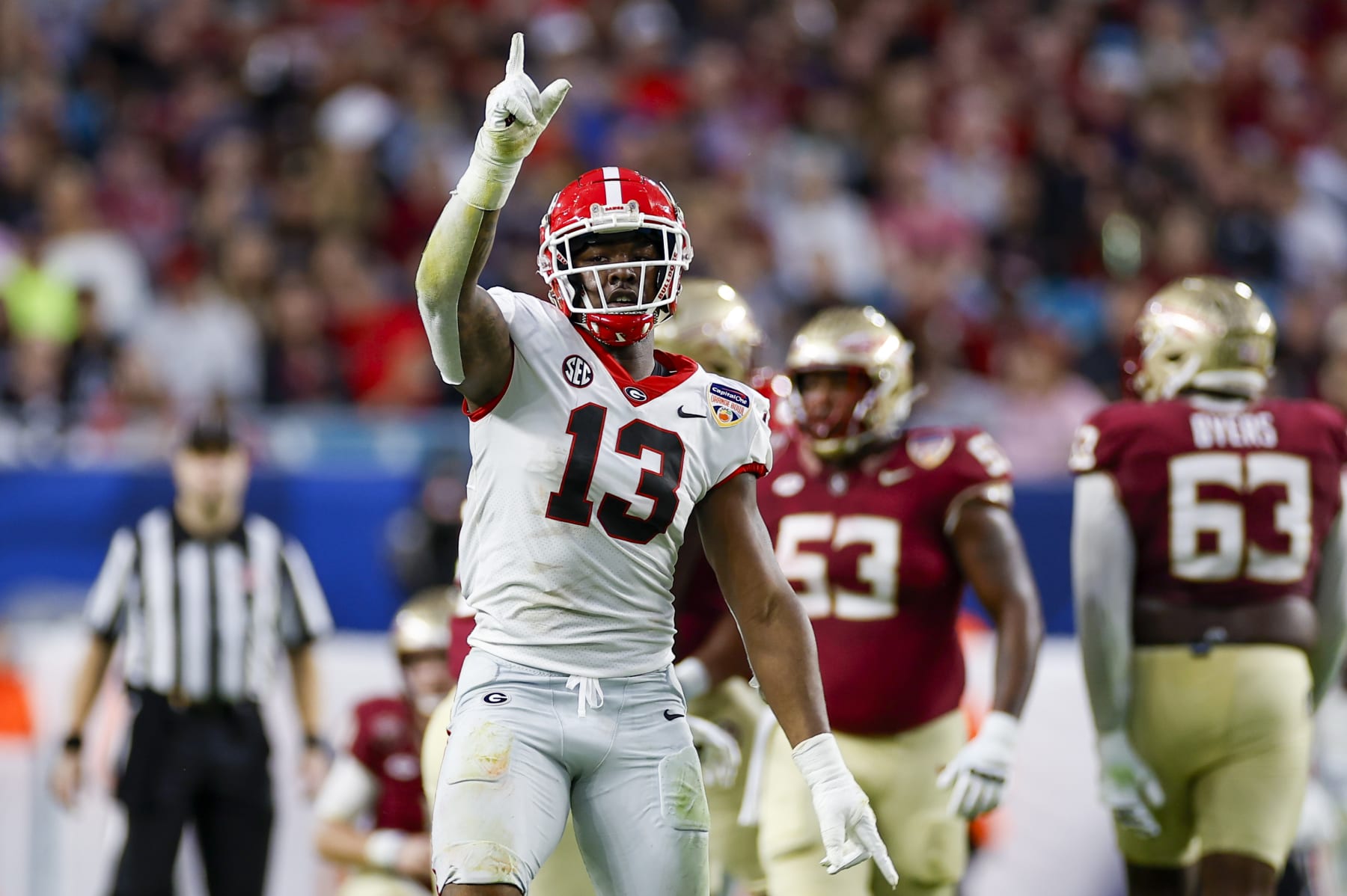 MIAMI GARDENS, FL - DECEMBER 30: Georgia Bulldogs defensive lineman Mykel Williams (13) reacts after a play between the Georgia Bulldogs and the Florida State Seminoles on December 30, 2023 at Hard Rock Stadium in Miami Gardens, Fl.  (Photo by David Rosenblum/Icon Sportswire via Getty Images)