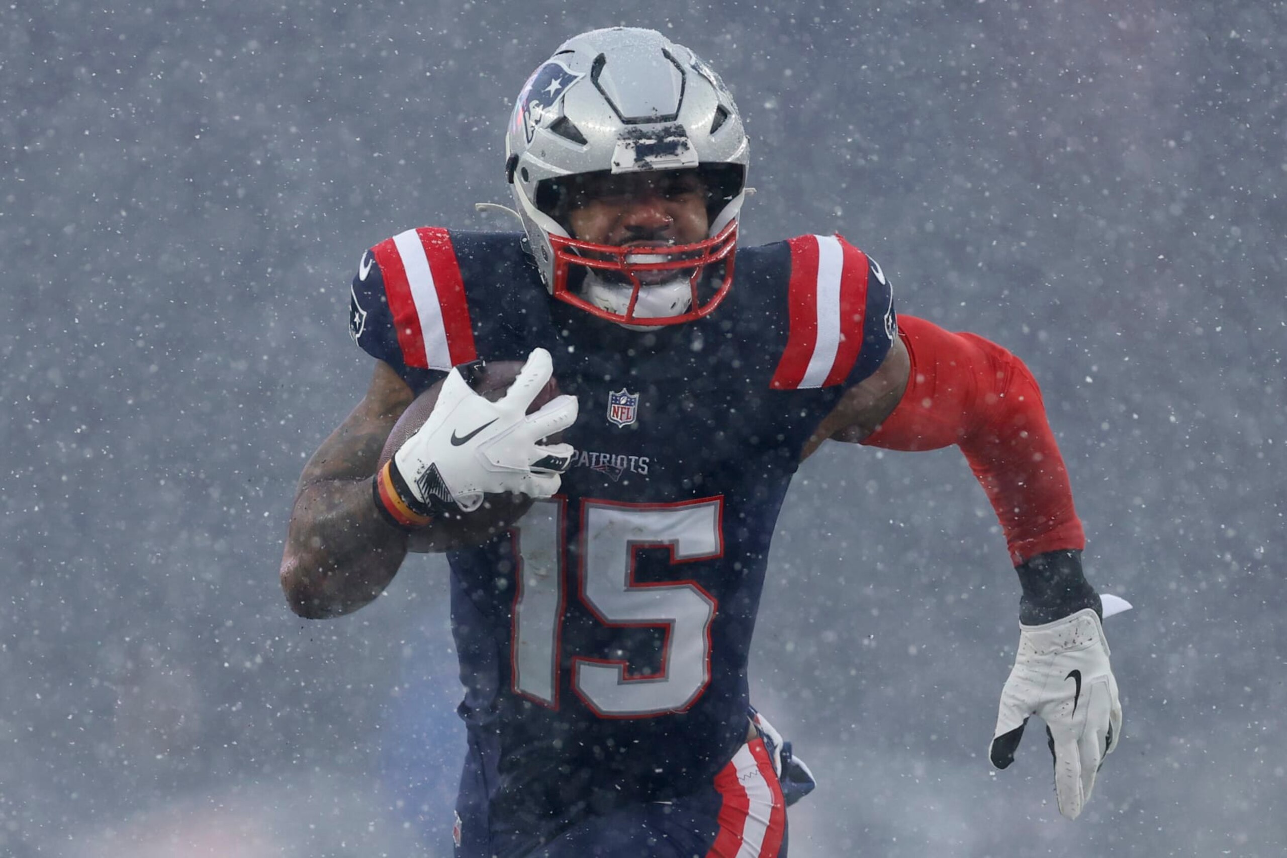 Foxborough, MA - January 7: New England Patriots RB Ezekiel Elliott rushes in the first half. The Patriots lost to the New York Jets, 17-3. (Photo by Danielle Parhizkaran/The Boston Globe via Getty Images)