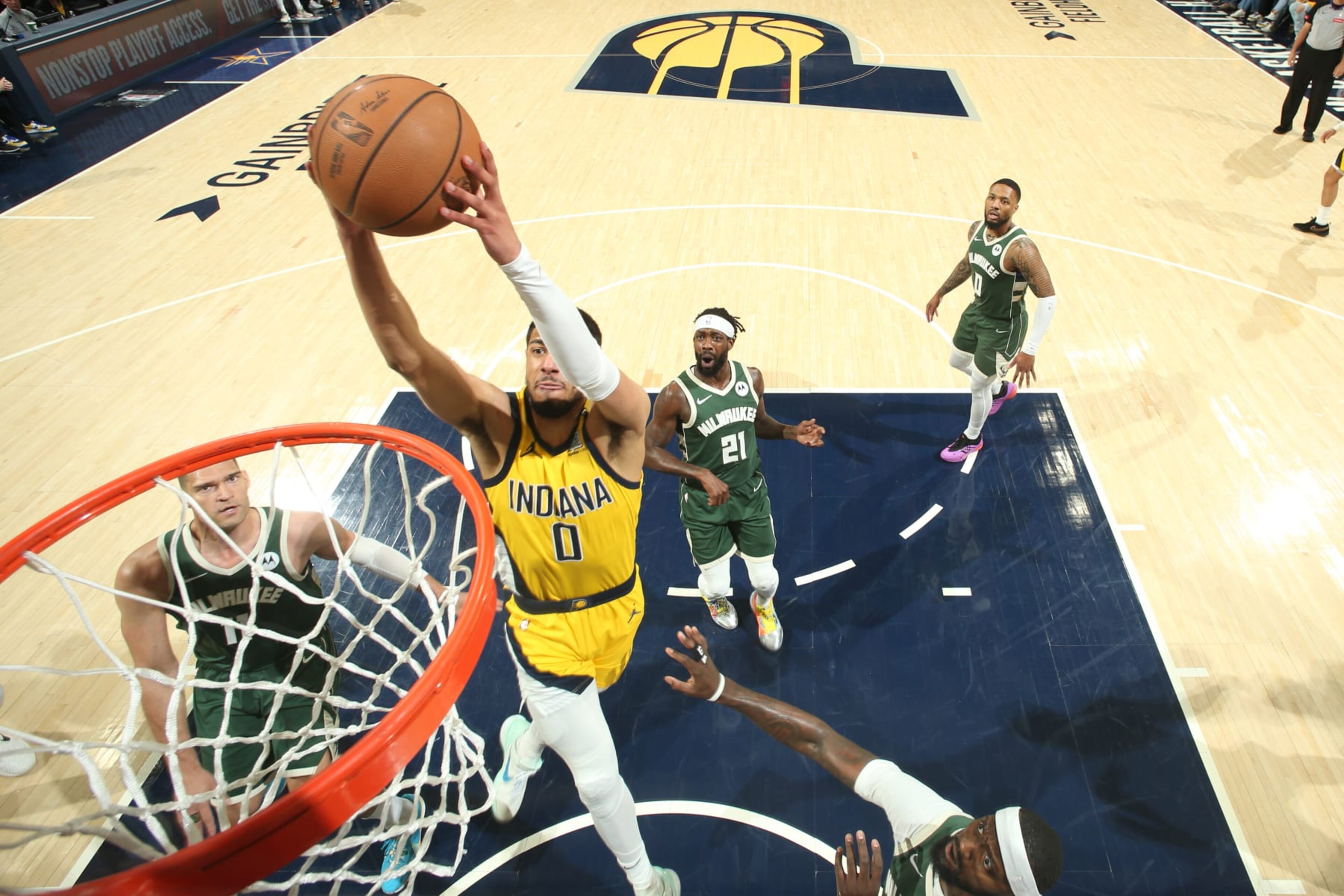 INDIANAPOLIS, IN - APRIL 26: Tyrese Haliburton #0 of the Indiana Pacers dunks the ball during the game against the Milwaukee Bucks during Round 1 Game 3 of the 2024 NBA Playoffs on April 26, 2024 at Gainbridge Fieldhouse in Indianapolis, Indiana. NOTE TO USER: User expressly acknowledges and agrees that, by downloading and or using this Photograph, user is consenting to the terms and conditions of the Getty Images License Agreement. Mandatory Copyright Notice: Copyright 2023 NBAE (Photo by Nathaniel S. Butler/NBAE via Getty Images) INDIANAPOLIS, IN - APRIL 26: Tyrese Haliburton #0 of the Indiana Pacers dunks the ball during the game against the Milwaukee Bucks during Round 1 Game 3 of the 2024 NBA Playoffs on April 26, 2024 at Gainbridge Fieldhouse in Indianapolis, Indiana. NOTE TO USER: User expressly acknowledges and agrees that, by downloading and or using this Photograph, user is consenting to the terms and conditions of the Getty Images License Agreement. Mandatory Copyright Notice: Copyright 2023 NBAE (Photo by Nathaniel S. Butler/NBAE via Getty Images)
