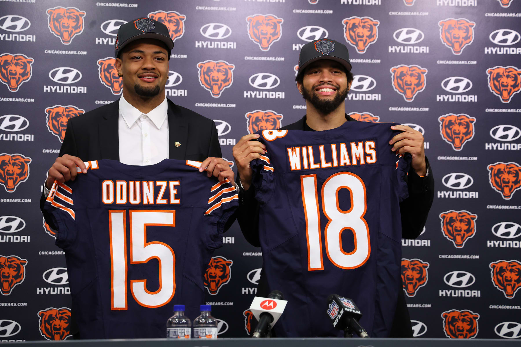 LAKE FOREST, ILLINOIS - APRIL 26: Rome Odunze #15 and Caleb Williams #18 of the Chicago Bears pose for a photo during their introductory press conference at Halas Hall on April 26, 2024 in Lake Forest, Illinois. Caleb Williams was selected first overall and Rome Odunze was selected ninth overall in the first round of the 2024 NFL Draft Thursday. (Photo by Michael Reaves/Getty Images)