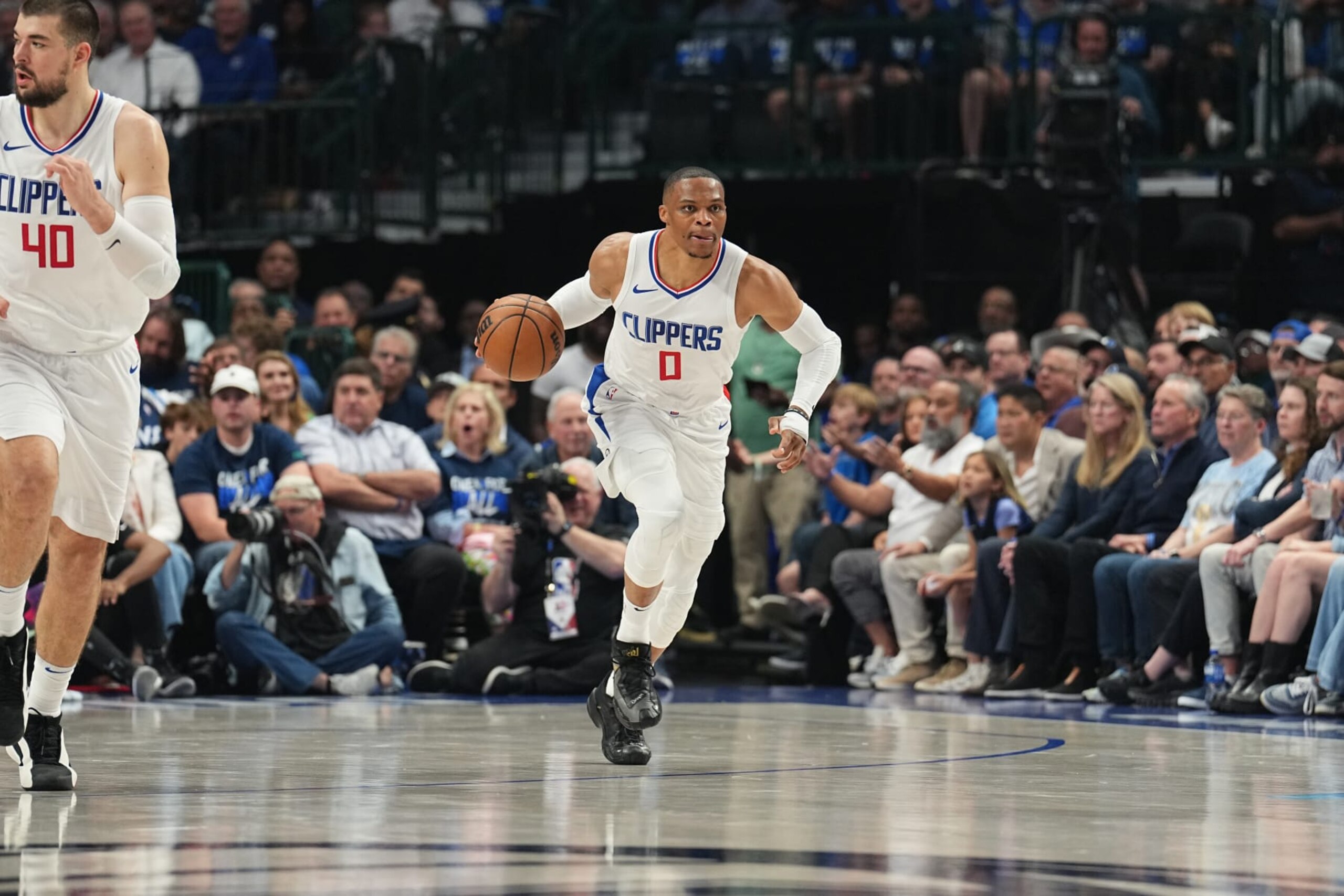 DALLAS, TX - APRIL 26: Russell Westbrook #0 of the LA Clippers dribbles the ball during the game against the Dallas Mavericks during Round 1 Game 3 of the 2024 NBA Playoffs on April 26, 2024 at the American Airlines Center in Dallas, Texas. NOTE TO USER: User expressly acknowledges and agrees that, by downloading and or using this photograph, User is consenting to the terms and conditions of the Getty Images License Agreement. Mandatory Copyright Notice: Copyright 2023 NBAE (Photo by Glenn James/NBAE via Getty Images)