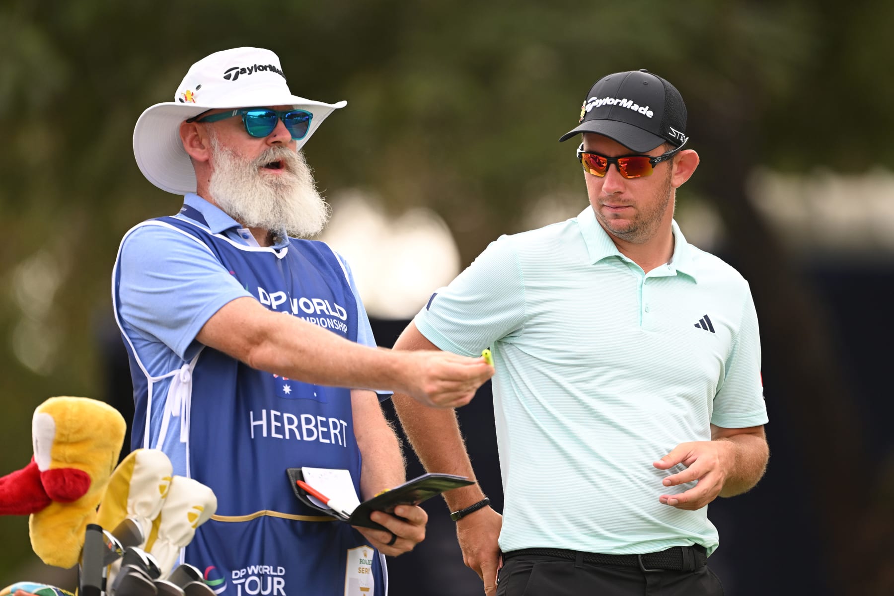 DUBAI, UNITED ARAB EMIRATES - NOVEMBER 16: Lucas Herbert of Australia looks across the fourth hole with his caddie, Nick Pugh during Day One of the DP World Tour Championship on the Earth Course at Jumeirah Golf Estates on November 16, 2023 in Dubai, United Arab Emirates. (Photo by Ross Kinnaird/Getty Images) DUBAI, UNITED ARAB EMIRATES - NOVEMBER 16: Lucas Herbert of Australia looks across the fourth hole with his caddie, Nick Pugh during Day One of the DP World Tour Championship on the Earth Course at Jumeirah Golf Estates on November 16, 2023 in Dubai, United Arab Emirates. (Photo by Ross Kinnaird/Getty Images)