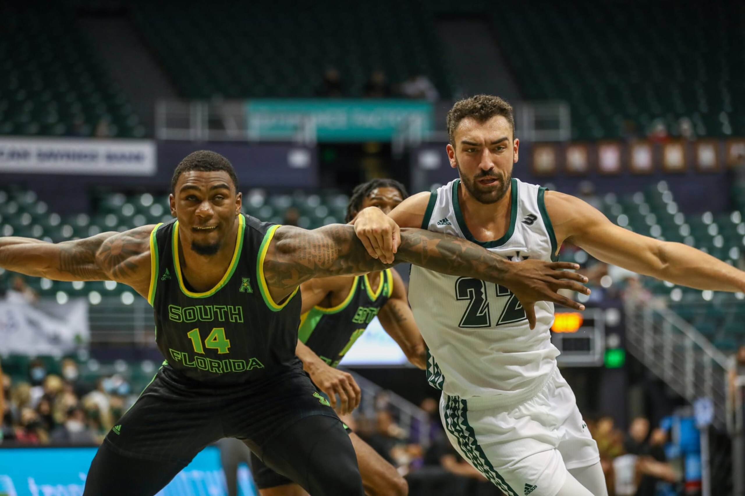 HONOLULU, HI - DECEMBER 23: Bayron Matos #14 of the South Florida Bulls and Jerome Desrosiers #22 of the Hawaii Rainbow Warriors battle for position during the 2021 Diamond Head Classic at the Stan Sheriff Center on December 23, 2021 in Honolulu, Hawaii.  (Photo by Darryl Oumi/Getty Images)