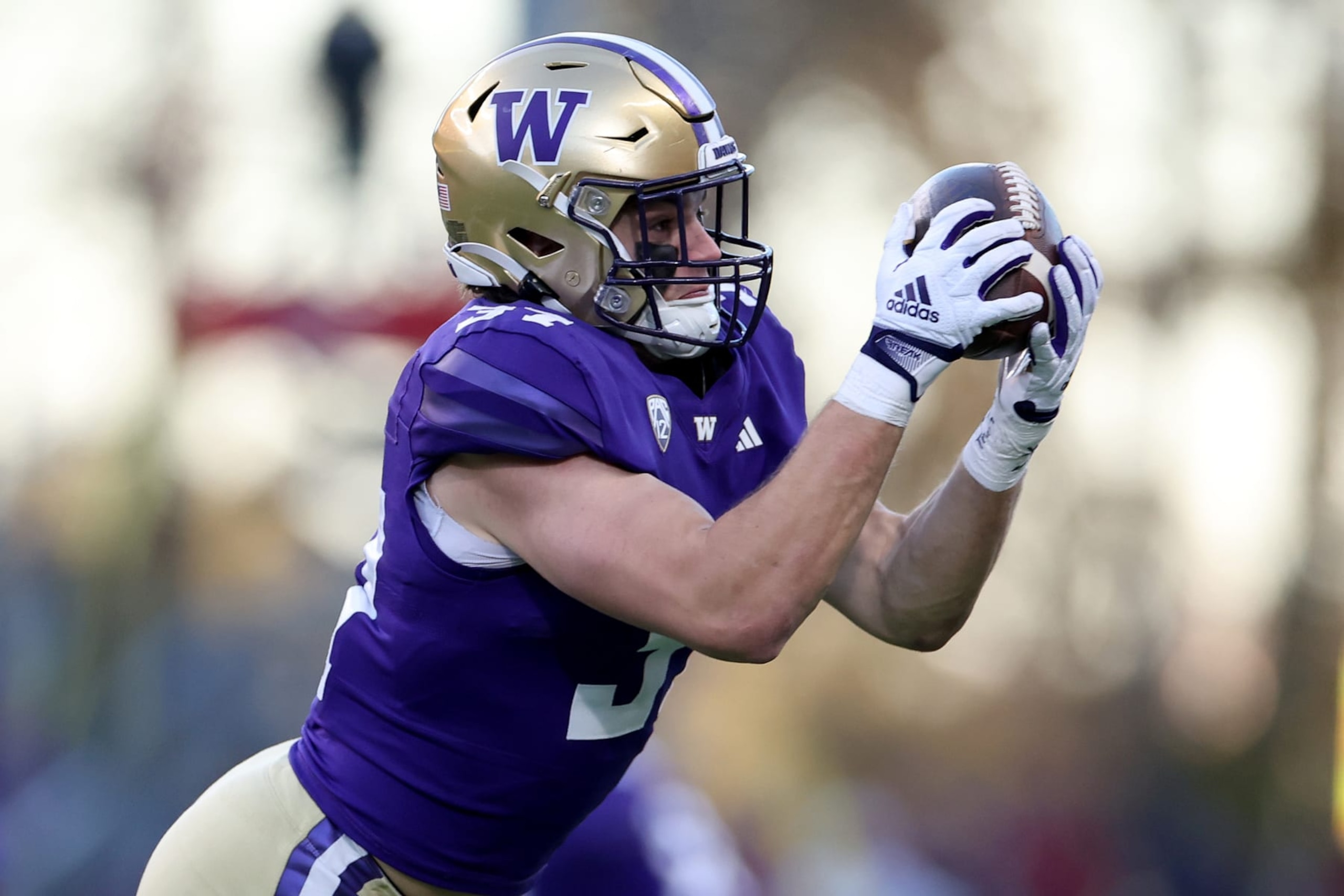 SEATTLE, WASHINGTON - NOVEMBER 25: Jack Westover #37 of the Washington Huskies catches a pass against the Washington State Cougars during the third quarter at Husky Stadium on November 25, 2023 in Seattle, Washington. (Photo by Steph Chambers/Getty Images)