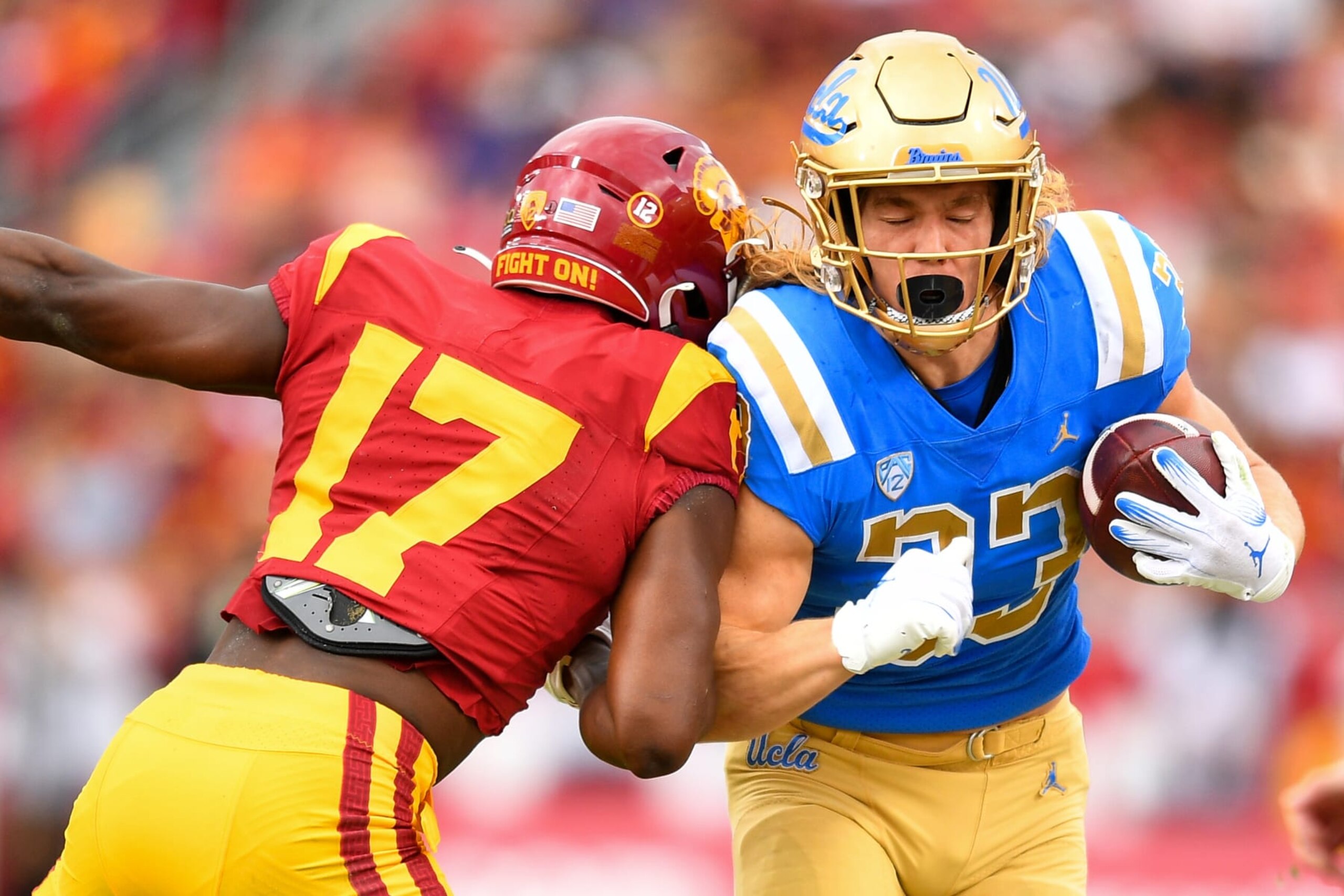 LOS ANGELES, CA - NOVEMBER 18: USC Trojans cornerback Christian Roland-Wallace (17) hits UCLA Bruins running back Carson Steele (33) during a college football game between the UCLA Bruins and the USC Trojans on November 18, 2023, at Los Angeles Memorial Coliseum in Los Angeles, CA. (Photo by Brian Rothmuller/Icon Sportswire via Getty Images)