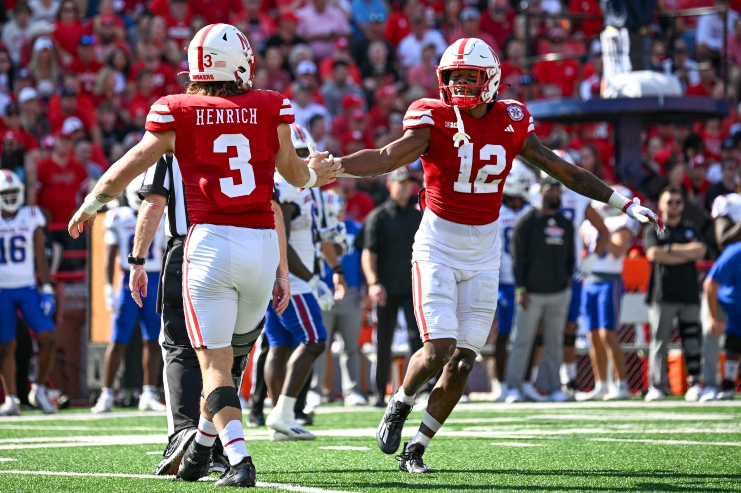 LINCOLN, NEBRASKA - SEPTEMBER 23: Defensive back Omar Brown #12 of the Nebraska Cornhuskers celebrates a stop with linebacker Nick Henrich #3 in the second quarter at Memorial Stadium on September 23, 2023 in Lincoln, Nebraska. (Photo by Steven Branscombe/Getty Images)