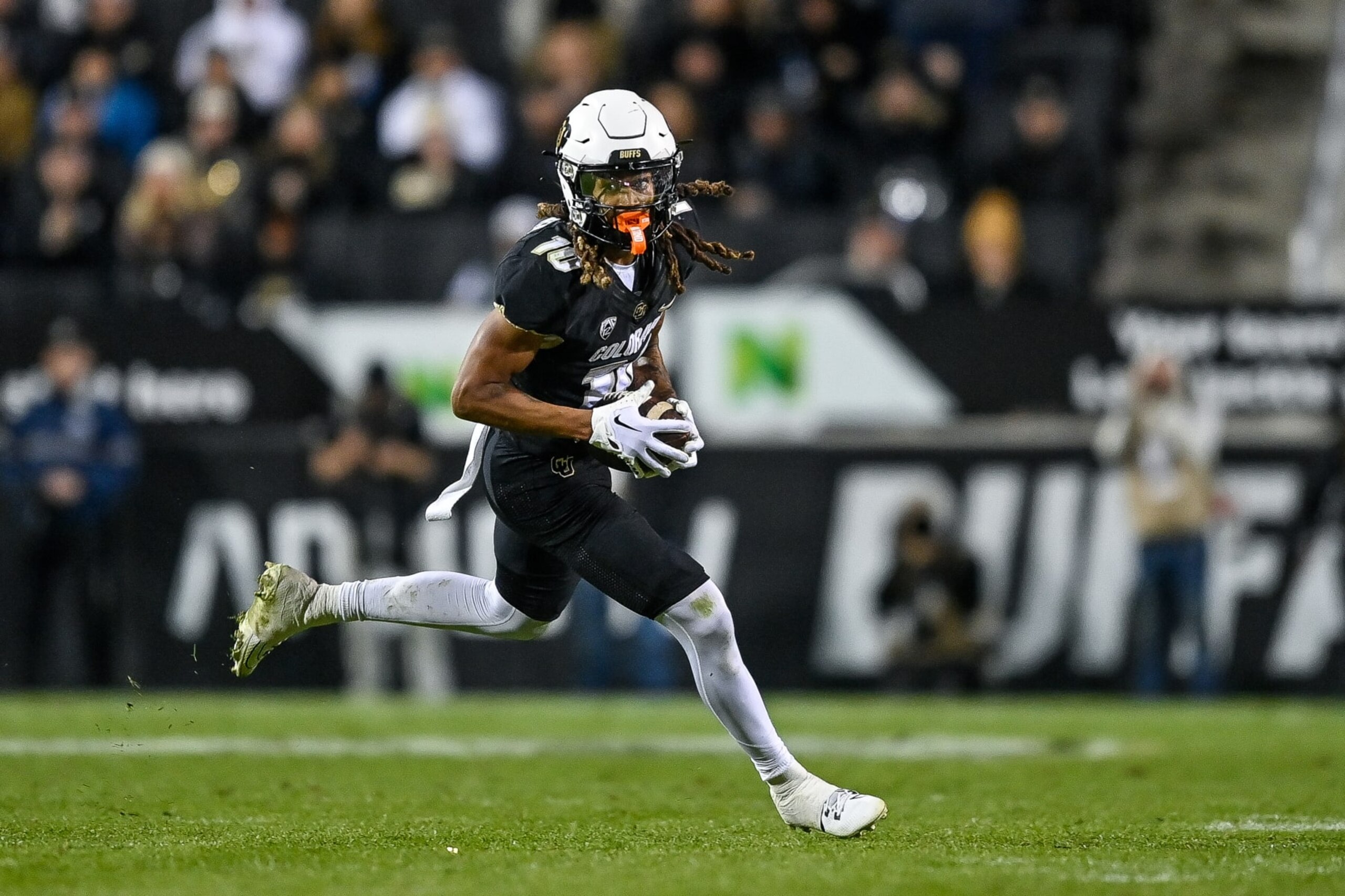 BOULDER, CO - NOVEMBER 4:  Wide receiver Xavier Weaver #10 of the Colorado Buffaloes runs after catching a pass in the fourth quarter against the Oregon State Beavers at Folsom Field on November 4, 2023 in Boulder, Colorado. (Photo by Dustin Bradford/Getty Images)