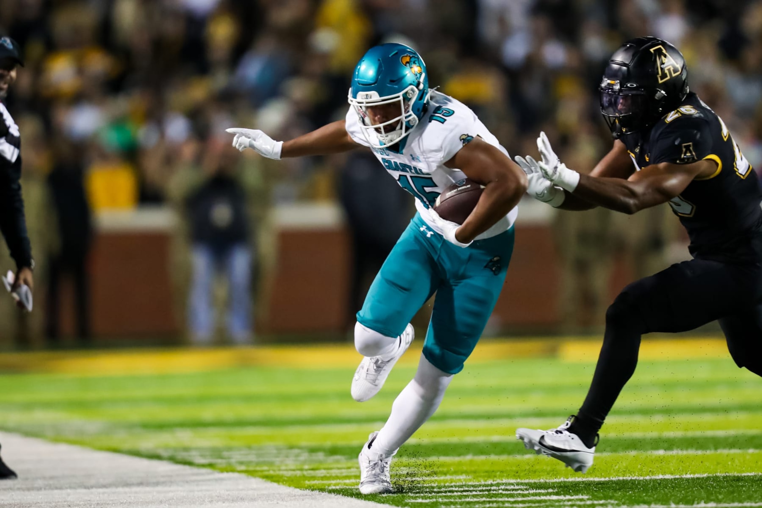 BOONE, NC - OCTOBER 10: Sam Pinckney #15 of the Coastal Carolina Chanticleers runs the ball during a football game against the Appalachian State Mountaineers at Kidd Brewer Stadium in Boone, North Carolina on Oct 10, 2023. (Photo by David Jensen/Icon Sportswire via Getty Images)