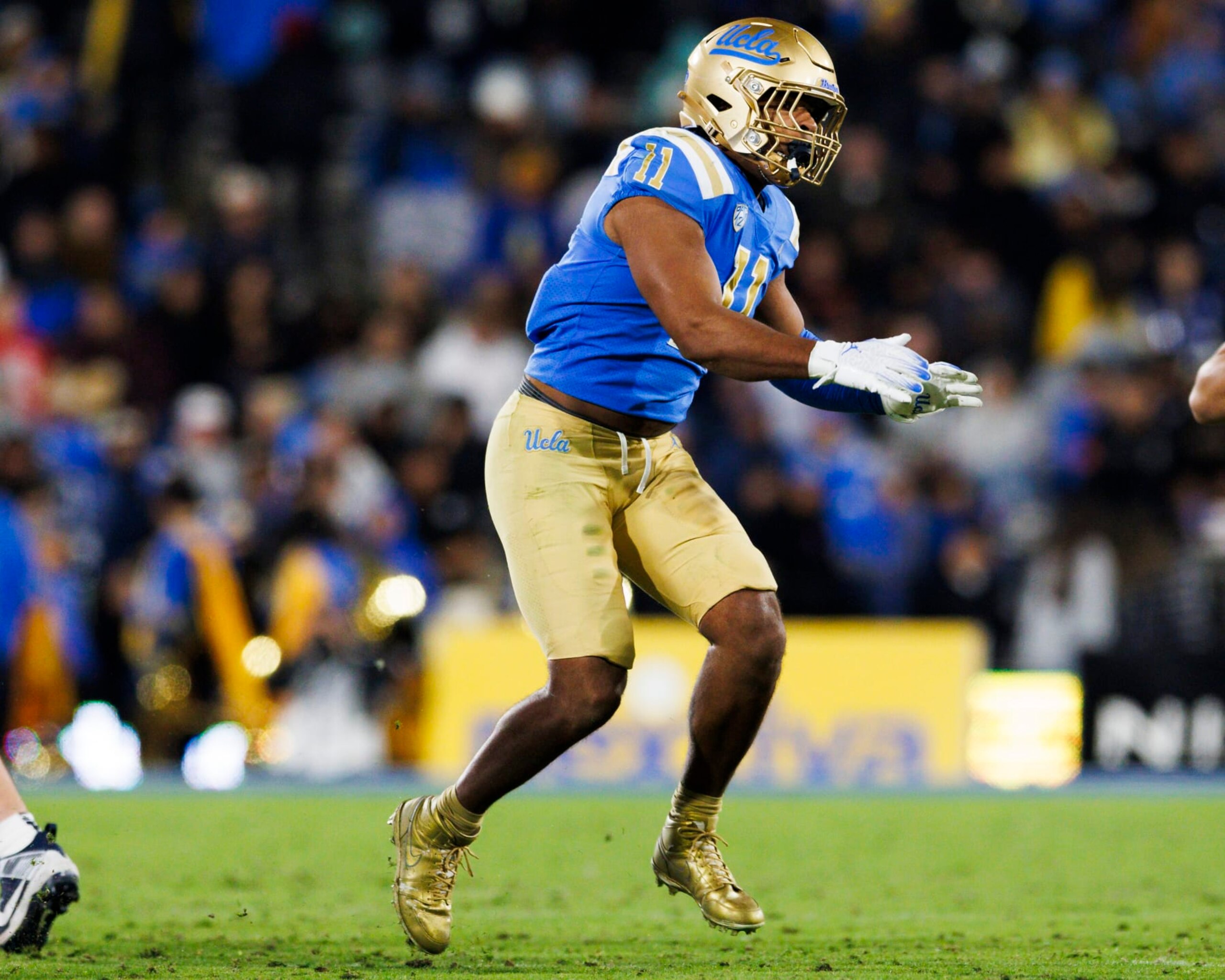 PASADENA, CA - NOVEMBER 25: UCLA Bruins defensive lineman Gabriel Murphy (11) rushes the edge during a college football game against Cal Golden Bears on November 25, 2023 at Rose Bowl Stadium in Pasadena, CA. (Photo by Ric Tapia/Icon Sportswire via Getty Images)