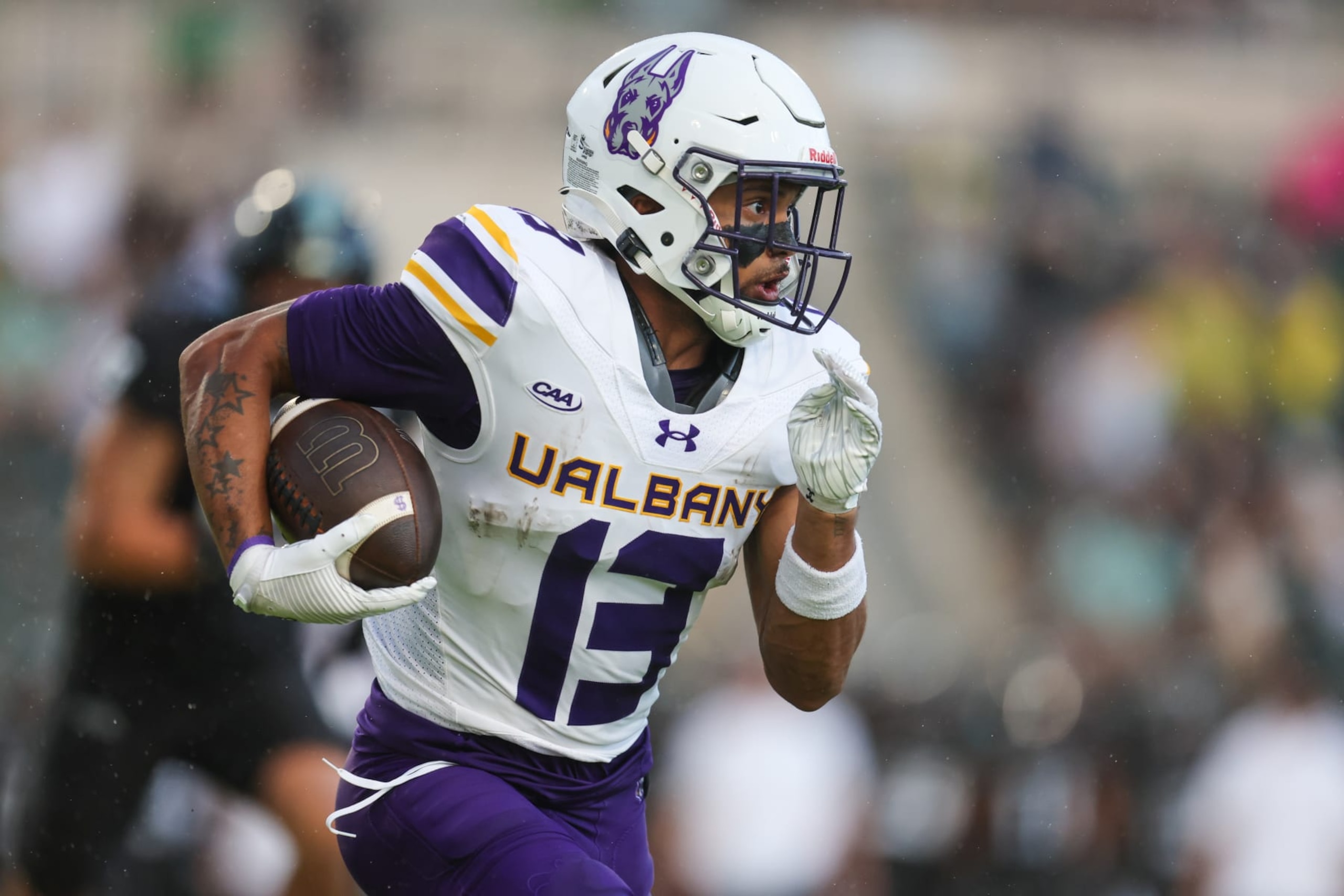 HONOLULU, HAWAII - SEPTEMBER 9: Brevin Easton #13 of the Albany Great Danes runs the ball during the first half of the game against the Hawaii Rainbow Warriors at Clarence T.C. Ching Athletics Complex on September 9, 2023 in Honolulu, Hawaii. (Photo by Darryl Oumi/Getty Images)
