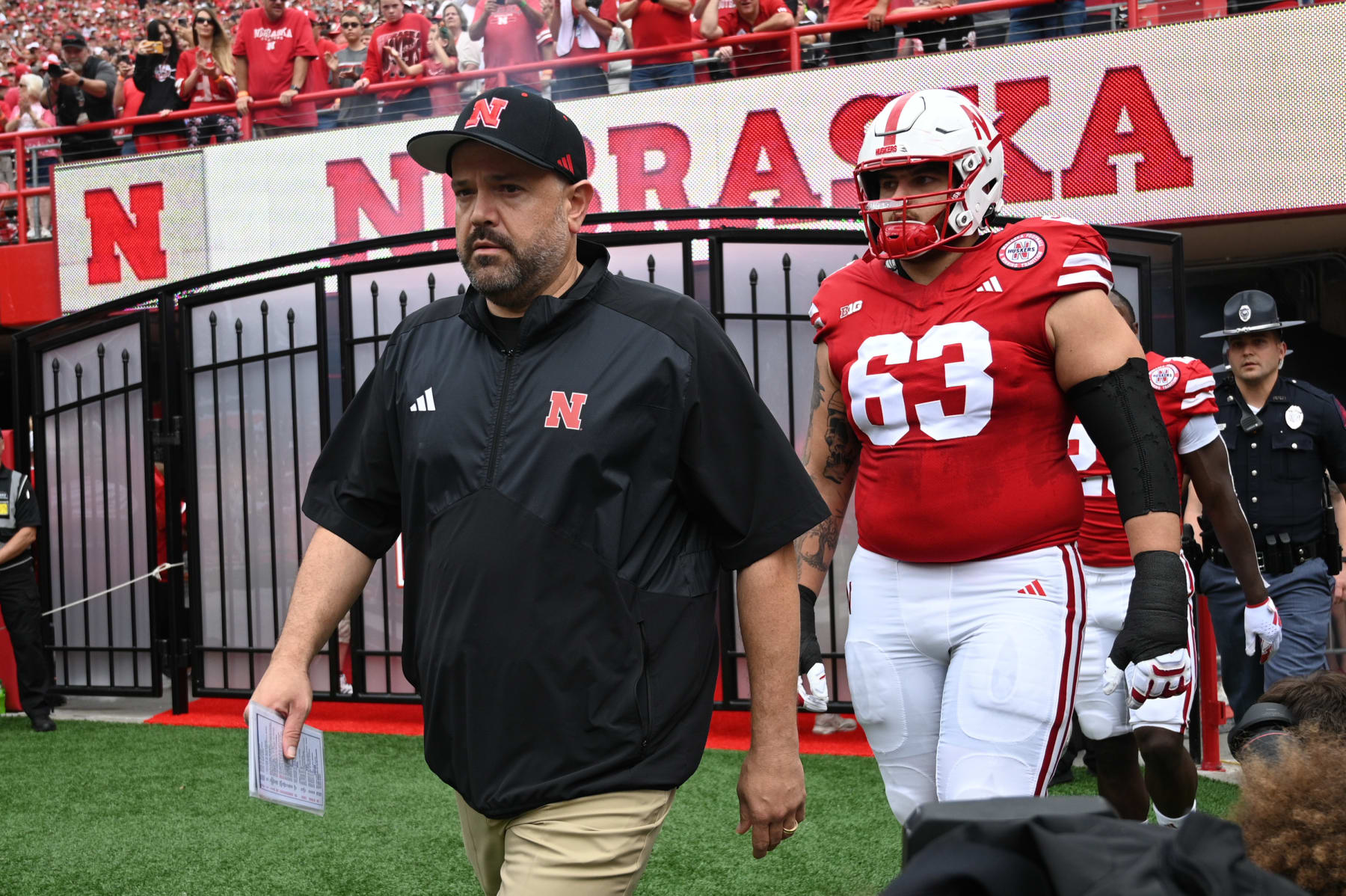 LINCOLN, NEBRASKA - SEPTEMBER 23: Head coach Matt Rhule of the Nebraska Cornhuskers and offensive lineman Nouredin Nouili #63 walk onto the field before the game against the Louisiana Tech Bulldogs at Memorial Stadium on September 23, 2023 in Lincoln, Nebraska. (Photo by Steven Branscombe/Getty Images)