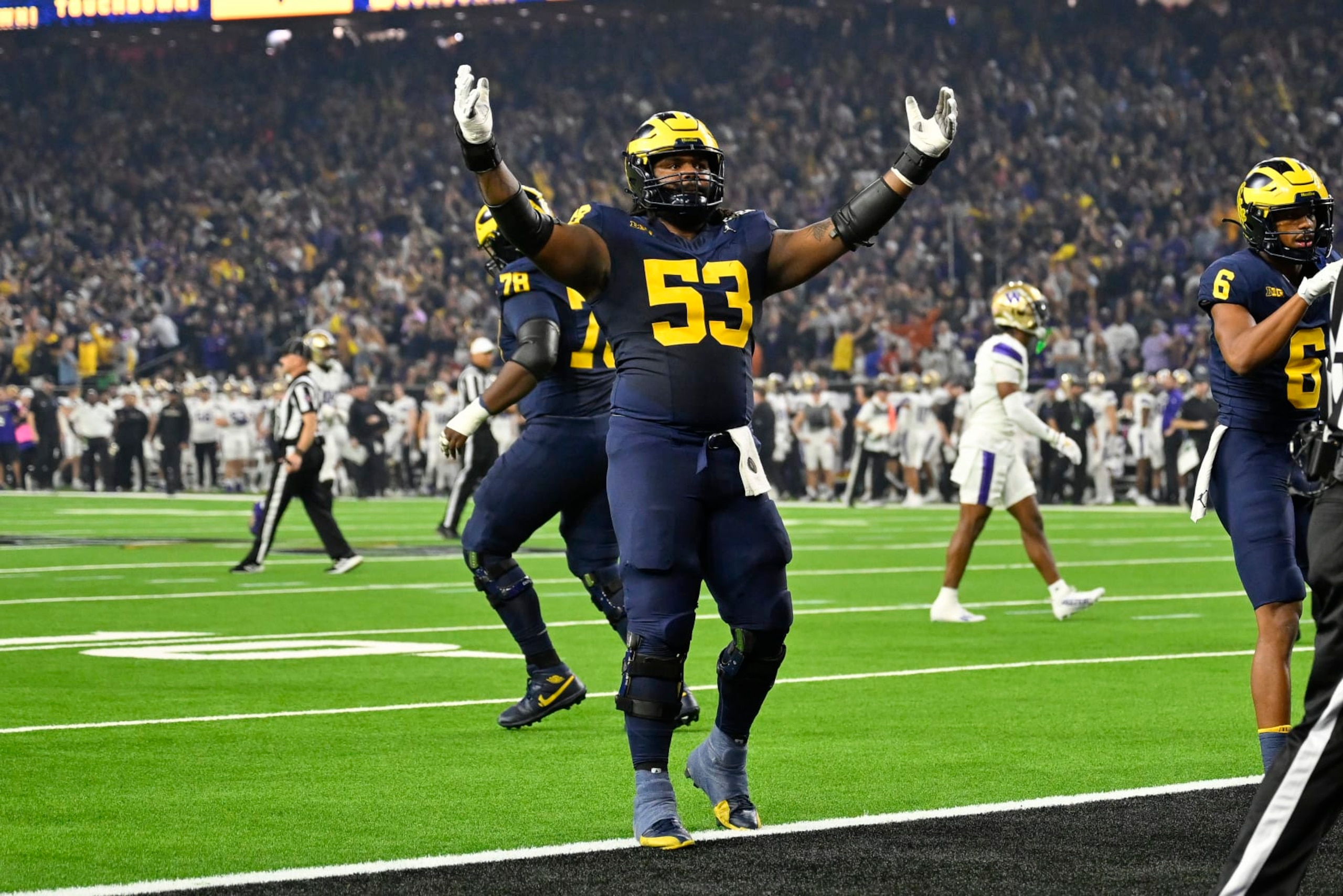 HOUSTON, TEXAS - JANUARY 08: Trente Jones #53 of the Michigan Wolverines celebrates during the first quarter of the 2024 CFP National Championship game against the Washington Huskies at NRG Stadium on January 08, 2024 in Houston, Texas. (Photo by Alika Jenner/Getty Images)