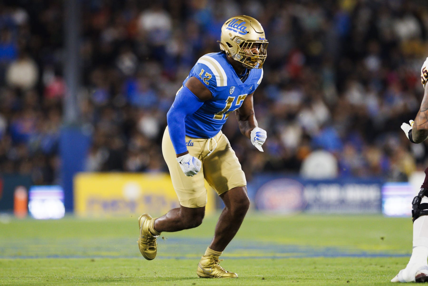 PASADENA, CA - NOVEMBER 11: UCLA Bruins defensive lineman Grayson Murphy (12) rushes the edge during a college football game against the Arizona State Sun Devils on November 11, 2023 at Rose Bowl Stadium in Pasadena, CA. (Photo by Ric Tapia/Icon Sportswire via Getty Images)
