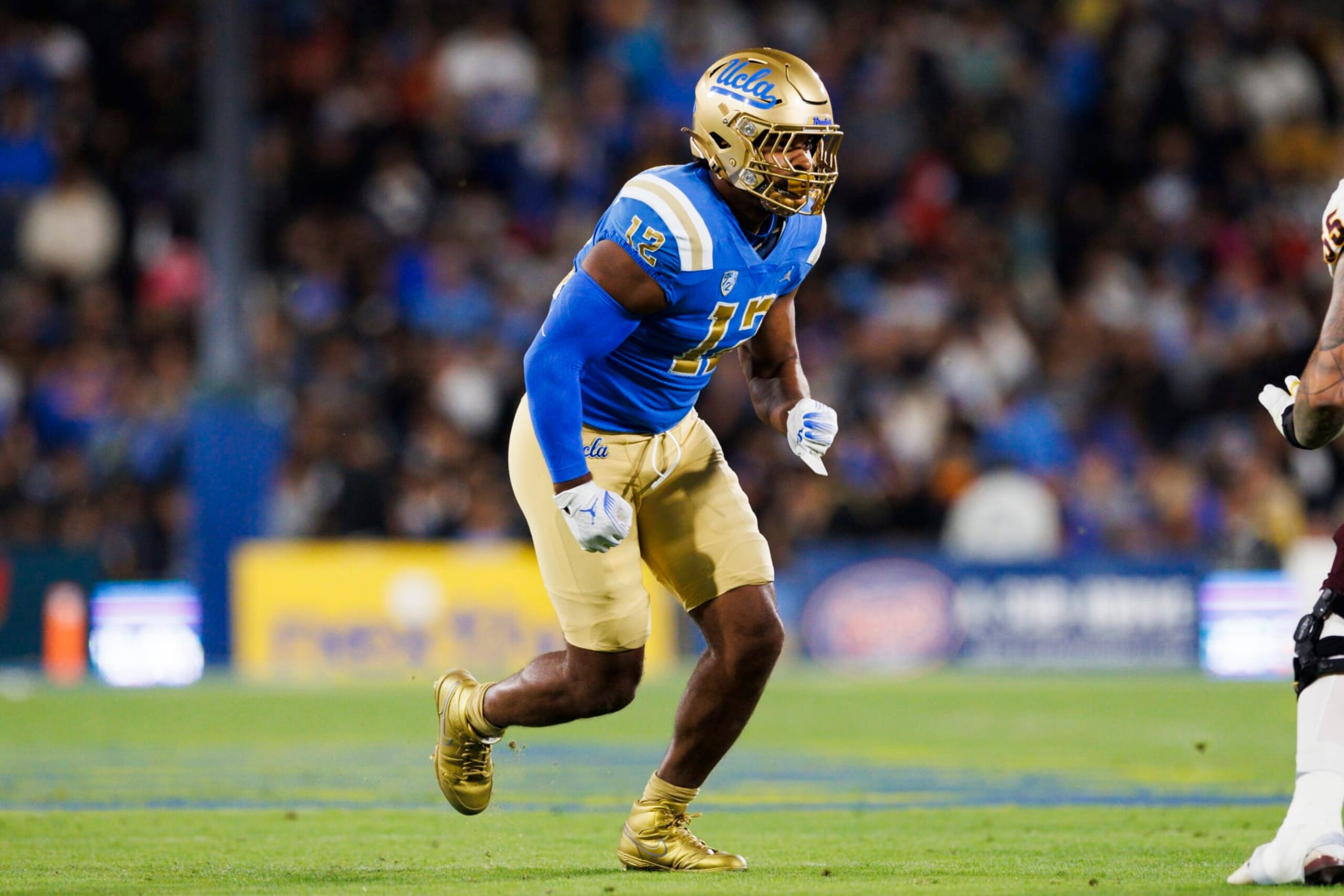 PASADENA, CA - NOVEMBER 11: UCLA Bruins defensive lineman Grayson Murphy (12) rushes the edge during a college football game against the Arizona State Sun Devils on November 11, 2023 at Rose Bowl Stadium in Pasadena, CA. (Photo by Ric Tapia/Icon Sportswire via Getty Images)