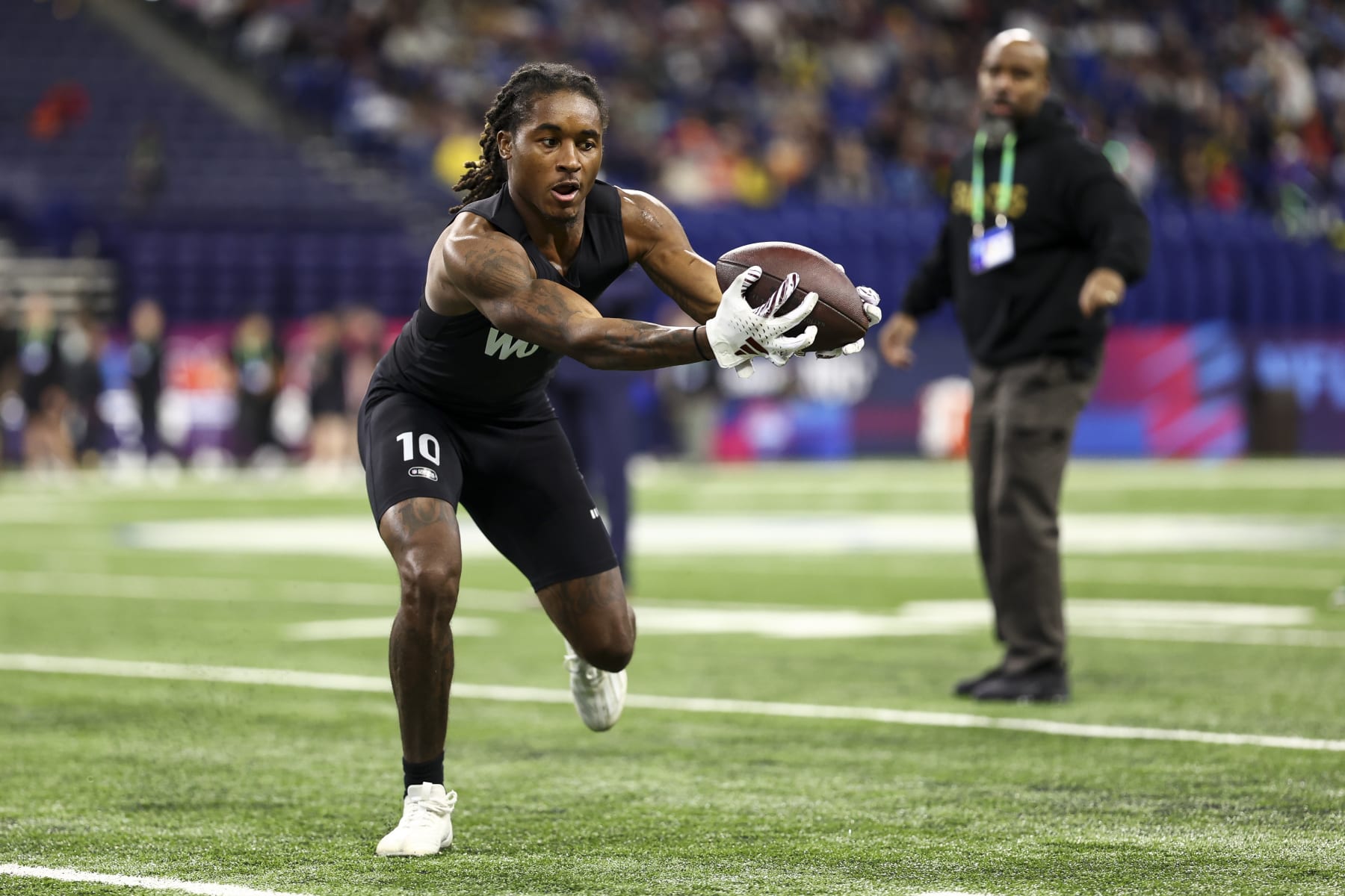 INDIANAPOLIS, INDIANA - MARCH 2: Tulu Griffin #WO10 of Mississippi State participates in a drill during the NFL Combine at the Lucas Oil Stadium on March 2, 2024 in Indianapolis, Indiana. (Photo by Kevin Sabitus/Getty Images)