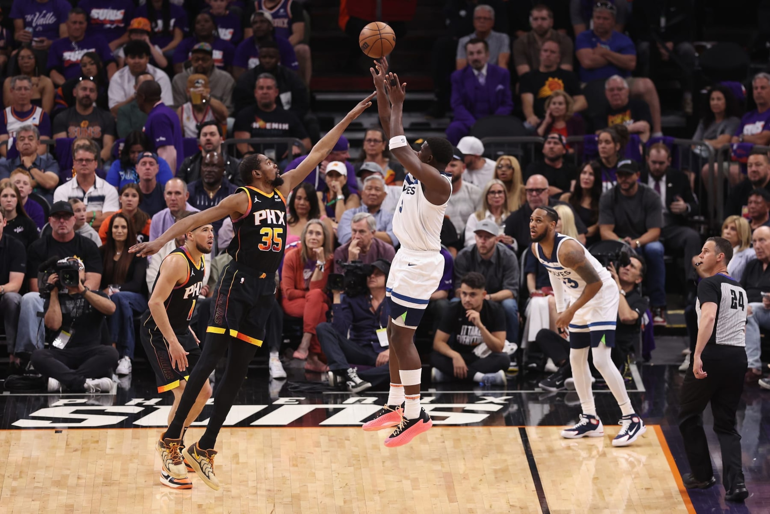 PHOENIX, ARIZONA - APRIL 26: Anthony Edwards #5 of the Minnesota Timberwolves attempts a shot over Kevin Durant #35 of the Phoenix Suns during the second half of game three of the Western Conference First Round Playoffs at Footprint Center on April 26, 2024 in Phoenix, Arizona. The Timberwolves defeated the Suns 126-109. ˆNOTE TO USER: User expressly acknowledges and agrees that, by downloading and or using this photograph, User is consenting to the terms and conditions of the Getty Images License Agreement. NOTE TO USER: User expressly acknowledges and agrees that, by downloading and or using this photograph, User is consenting to the terms and conditions of the Getty Images License Agreement. ˆ (Photo by Christian Petersen/Getty Images) PHOENIX, ARIZONA - APRIL 26: Anthony Edwards #5 of the Minnesota Timberwolves attempts a shot over Kevin Durant #35 of the Phoenix Suns during the second half of game three of the Western Conference First Round Playoffs at Footprint Center on April 26, 2024 in Phoenix, Arizona. The Timberwolves defeated the Suns 126-109. ˆNOTE TO USER: User expressly acknowledges and agrees that, by downloading and or using this photograph, User is consenting to the terms and conditions of the Getty Images License Agreement. NOTE TO USER: User expressly acknowledges and agrees that, by downloading and or using this photograph, User is consenting to the terms and conditions of the Getty Images License Agreement. ˆ (Photo by Christian Petersen/Getty Images)