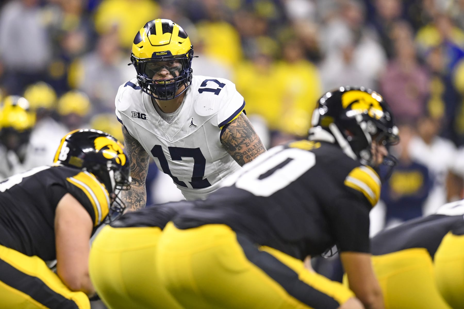 INDIANAPOLIS, IN - DECEMBER 02: Michigan Wolverines Edge Rusher Braiden McGregor (17) looks across the line of scrimmage during the Big Ten Championship Game between the Michigan Wolverines and the Iowa Hawkeyes on December 2, 2023, at Lucas Oil Stadium in Indianapolis, Indiana. (Photo by Michael Allio/Icon Sportswire via Getty Images)