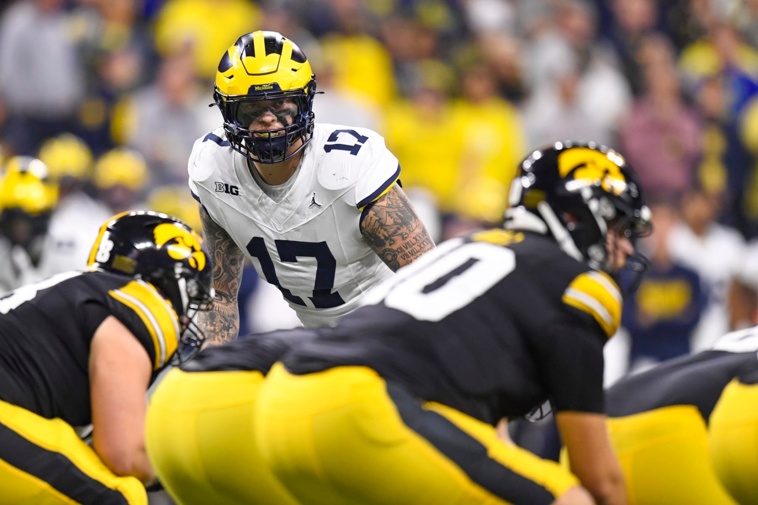 INDIANAPOLIS, IN - DECEMBER 02: Michigan Wolverines Edge Rusher Braiden McGregor (17) looks across the line of scrimmage during the Big Ten Championship Game between the Michigan Wolverines and the Iowa Hawkeyes on December 2, 2023, at Lucas Oil Stadium in Indianapolis, Indiana. (Photo by Michael Allio/Icon Sportswire via Getty Images)