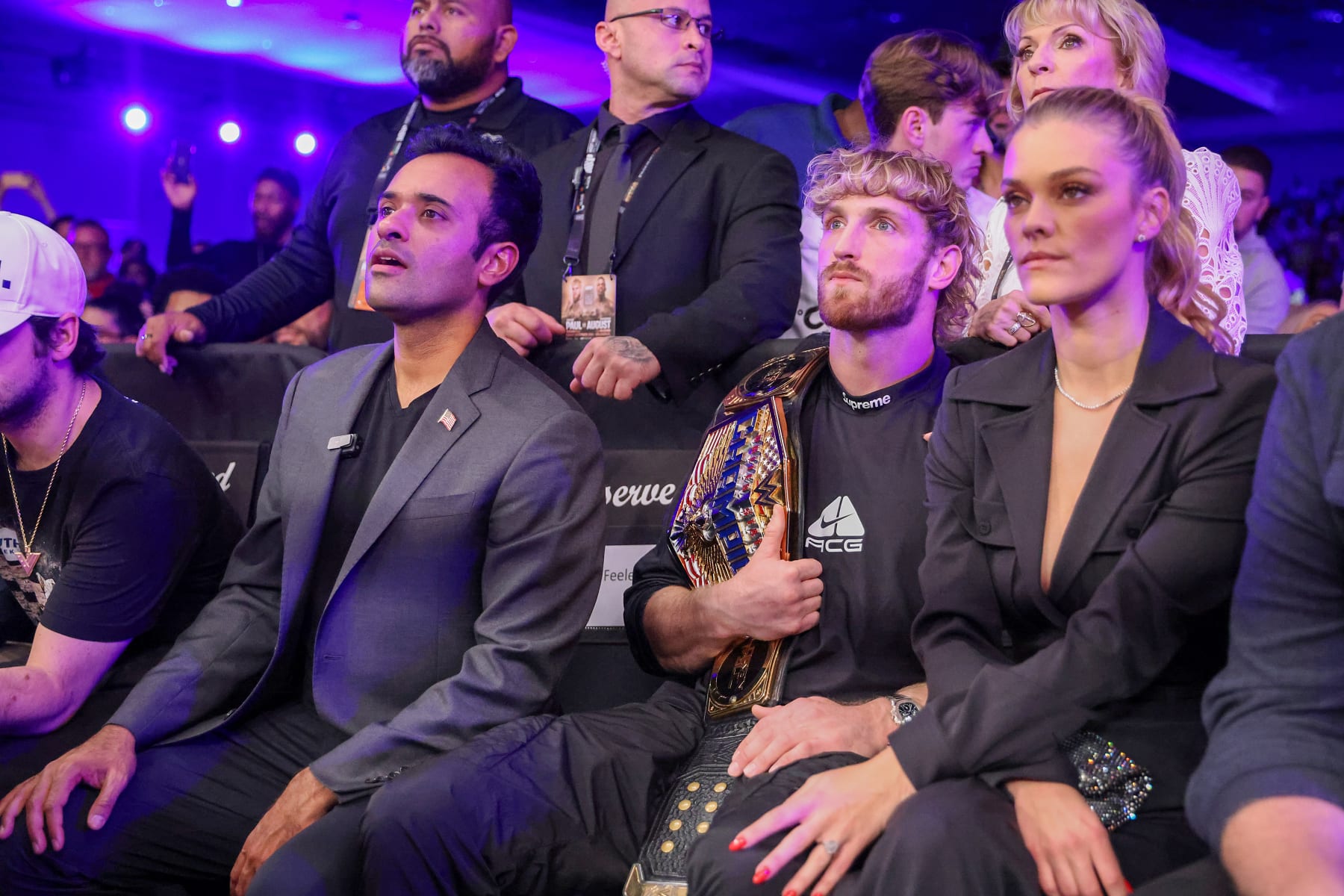 ORLANDO, FL - DECEMBER 15: Vivek Ramaswamy watches with Logan Paul and Nina Agdal as Jake Paul and Andre August fight during the Jake Paul v Andre August at the Caribe Royale Orlando on December 15 2023 in Orlando, Florida. (Photo by Alex Menendez/Getty Images)