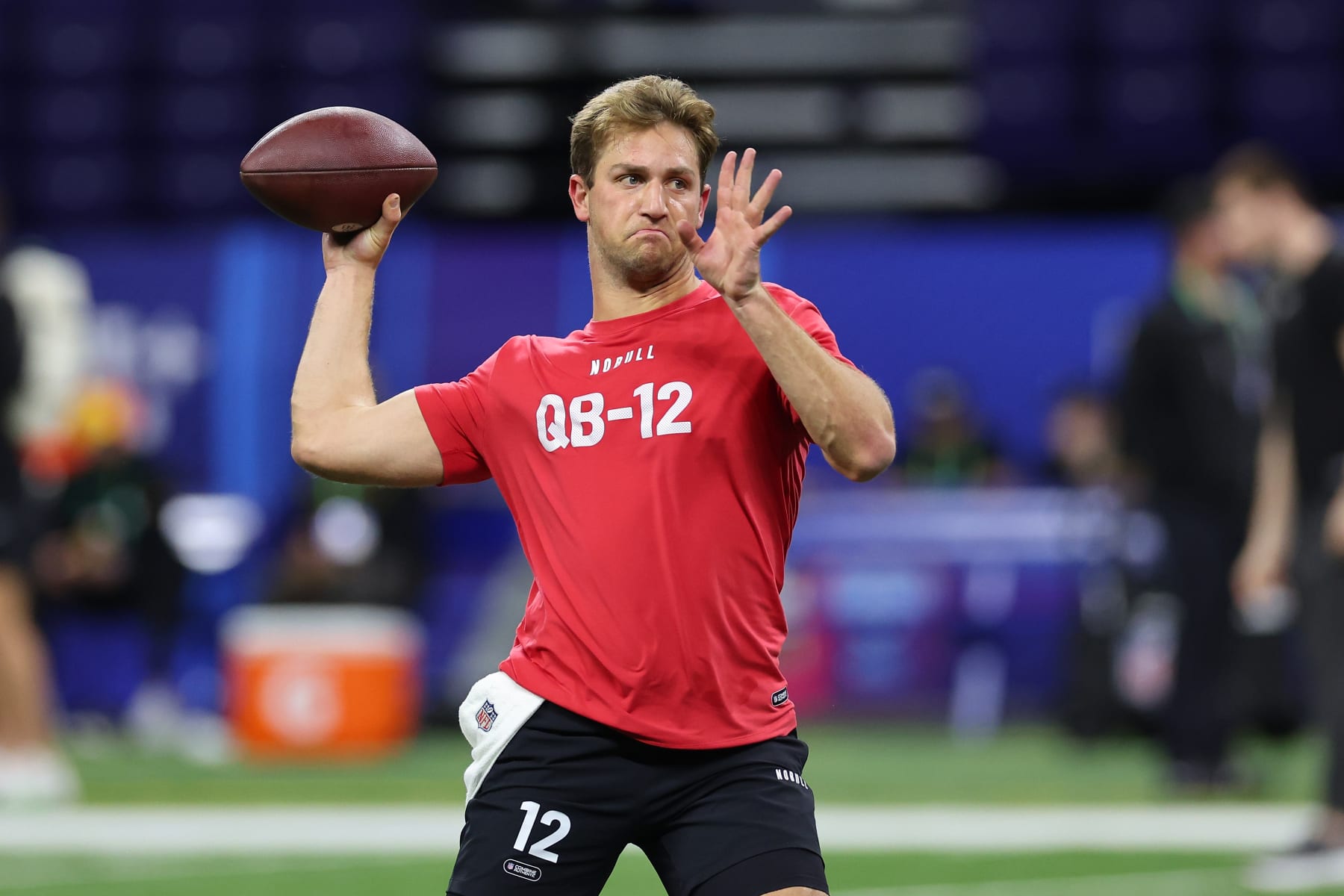 INDIANAPOLIS, INDIANA - MARCH 02: Kedon Slovis #QB12 of Brigham Young participates in a drill during the NFL Combine at Lucas Oil Stadium on March 02, 2024 in Indianapolis, Indiana. (Photo by Stacy Revere/Getty Images)