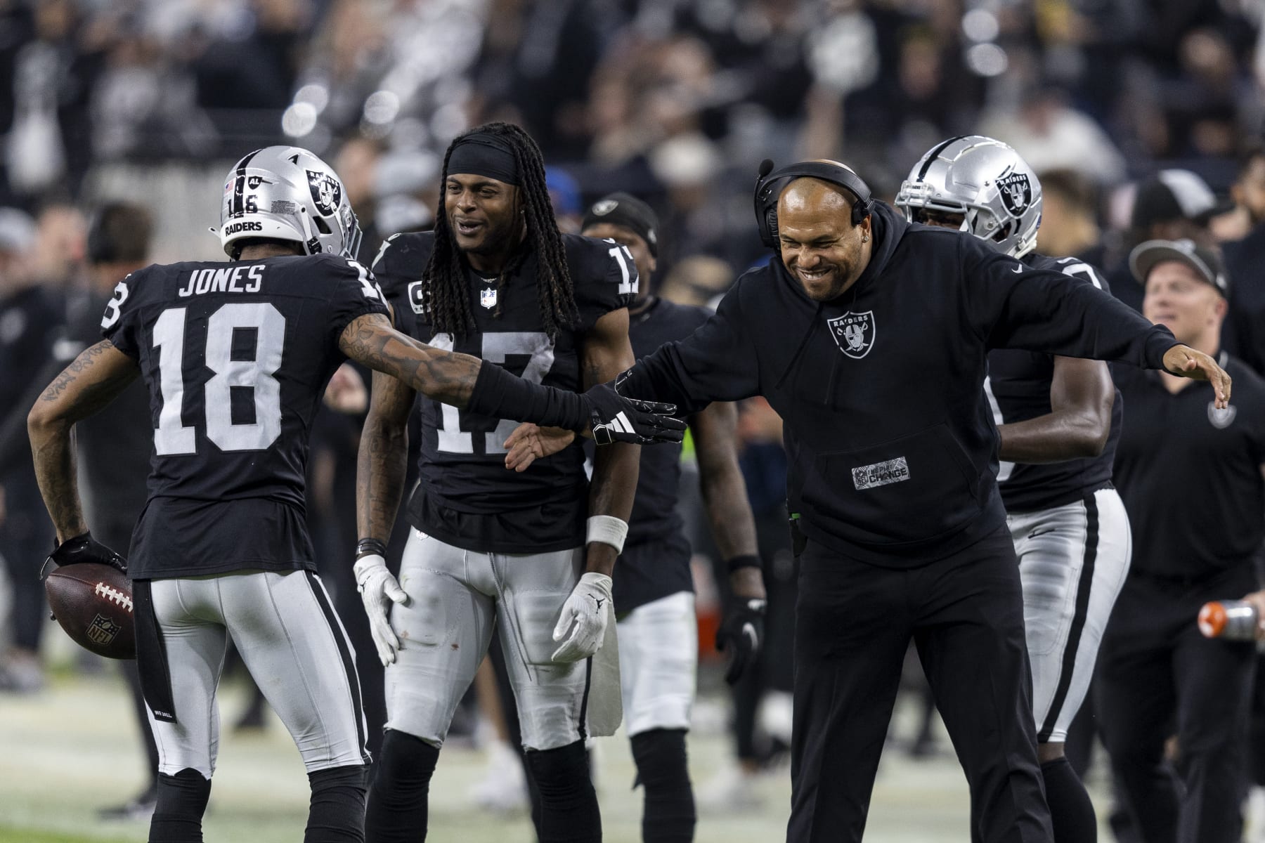 LAS VEGAS, NEVADA - DECEMBER 14: Jack Jones #18 of the Las Vegas Raiders celebrates with head coach Antonio Pierce of the Las Vegas Raiders after a pick six during an NFL football game between the Las Vegas Raiders and the Los Angeles Chargers at Allegiant Stadium on December 14, 2023 in Las Vegas, Nevada. (Photo by Michael Owens/Getty Images)