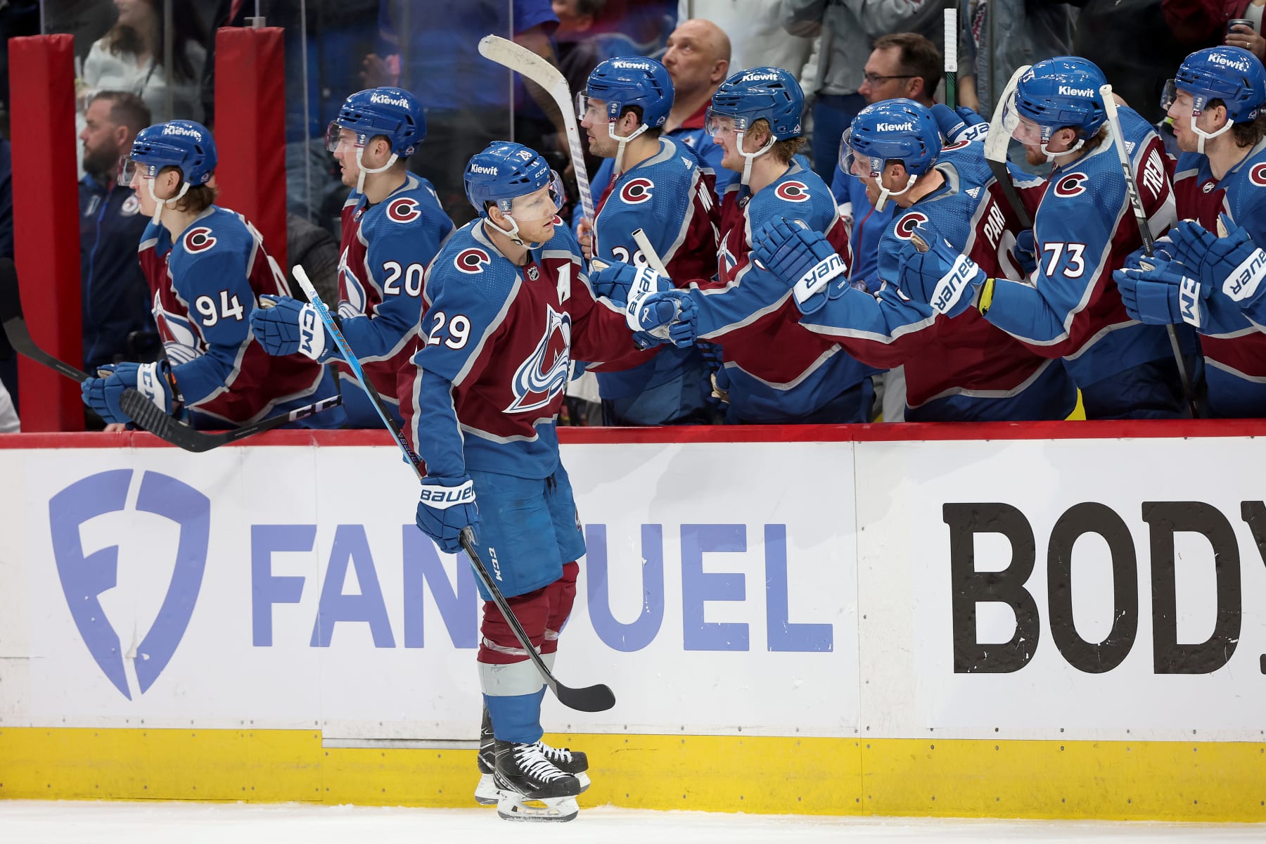 DENVER, COLORADO - APRIL 26: Nathan MacKinnon #29 of the Colorado Avalanche celebrates with his teammates after scoring against the Winnipeg Jets in the third period during Game Three of the First Round of the 2024 Stanley Cup Playoffs at Ball Arena on April 26, 2024 in Denver, Colorado.  (Photo by Matthew Stockman/Getty Images)