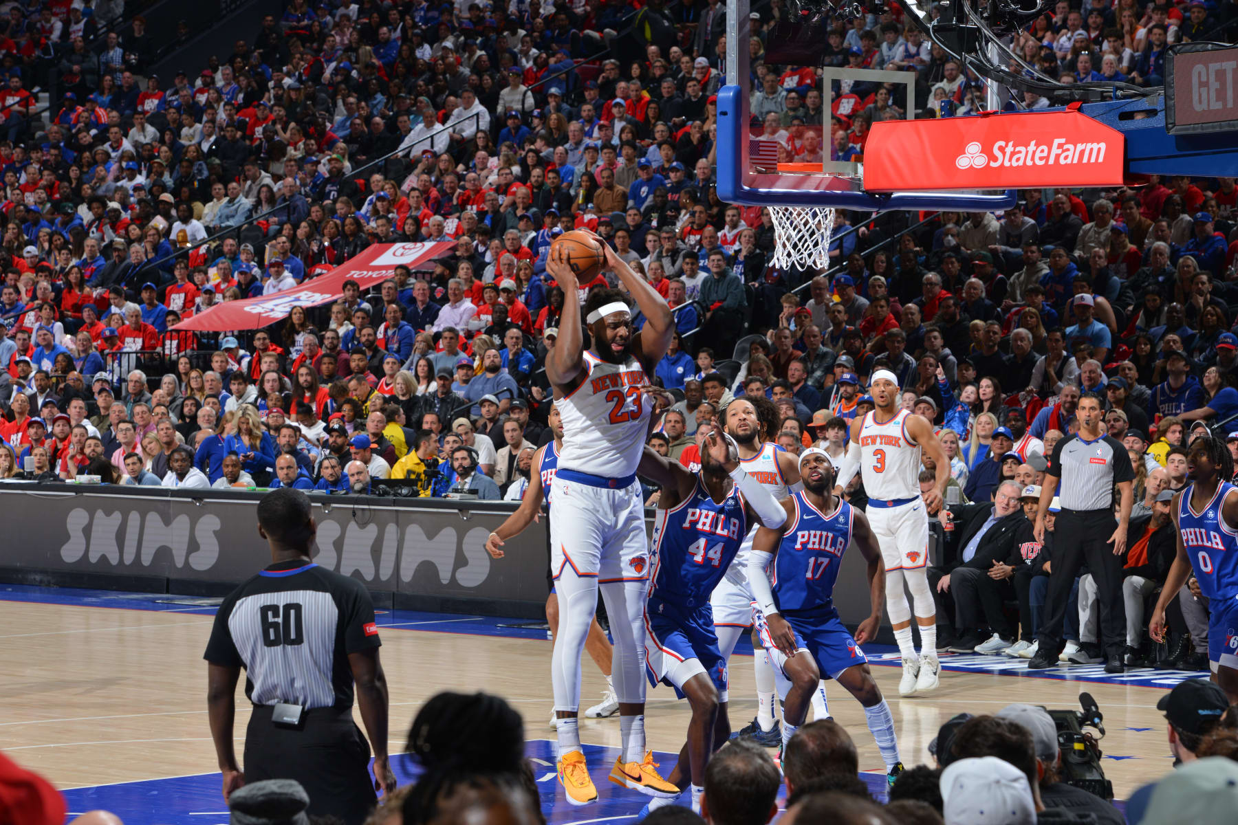 PHILADELPHIA, PA - APRIL 25: Mitchell Robinson #23 of the New York Knicks rebounds the ball during the game against the Philadelphia 76ers during Round 1 Game 3 of the 2024 NBA Playoffs on April 25, 2024 at the Wells Fargo Center in Philadelphia, Pennsylvania NOTE TO USER: User expressly acknowledges and agrees that, by downloading and/or using this Photograph, user is consenting to the terms and conditions of the Getty Images License Agreement. Mandatory Copyright Notice: Copyright 2024 NBAE (Photo by Jesse D. Garrabrant/NBAE via Getty Images)