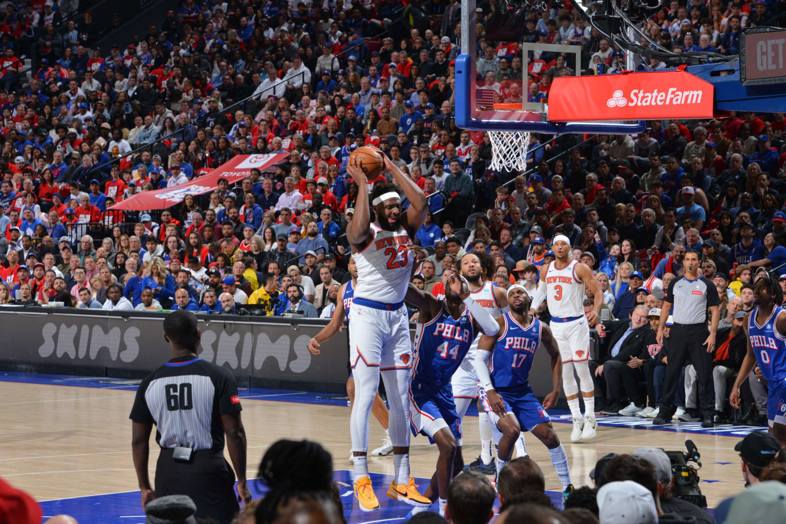 PHILADELPHIA, PA - APRIL 25: Mitchell Robinson #23 of the New York Knicks rebounds the ball during the game against the Philadelphia 76ers during Round 1 Game 3 of the 2024 NBA Playoffs on April 25, 2024 at the Wells Fargo Center in Philadelphia, Pennsylvania NOTE TO USER: User expressly acknowledges and agrees that, by downloading and/or using this Photograph, user is consenting to the terms and conditions of the Getty Images License Agreement. Mandatory Copyright Notice: Copyright 2024 NBAE (Photo by Jesse D. Garrabrant/NBAE via Getty Images)