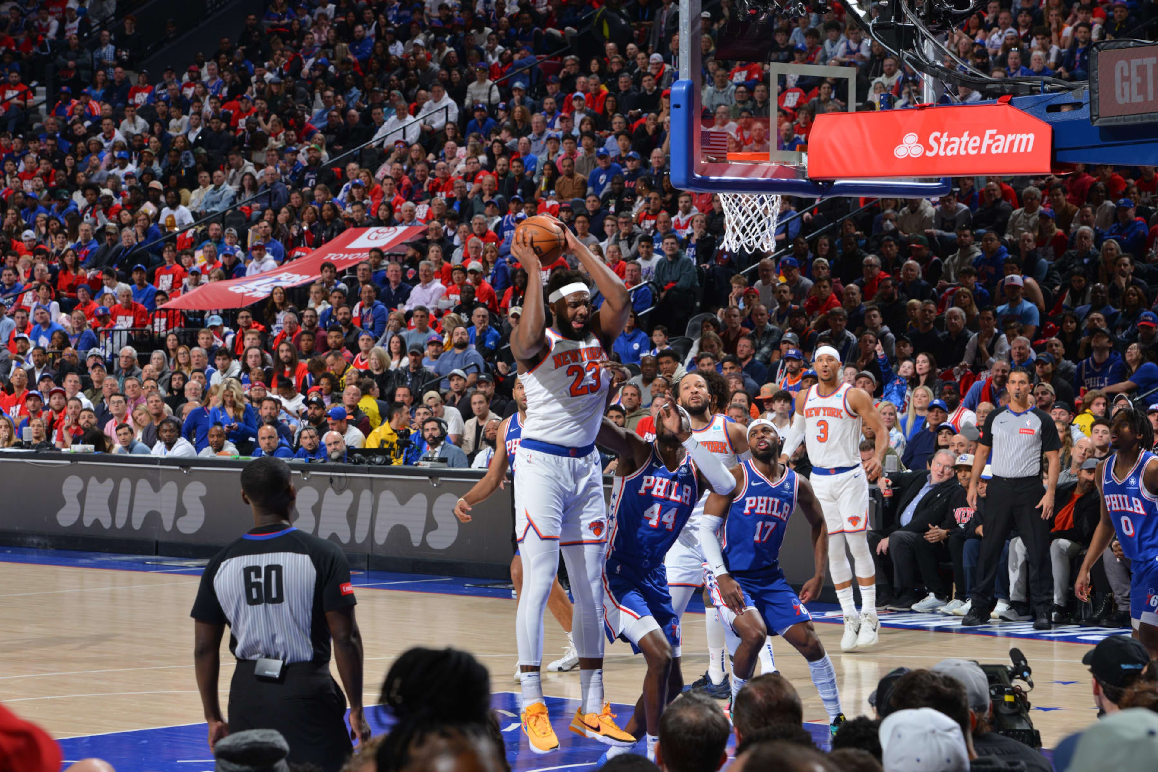PHILADELPHIA, PA - APRIL 25: Mitchell Robinson #23 of the New York Knicks rebounds the ball during the game against the Philadelphia 76ers during Round 1 Game 3 of the 2024 NBA Playoffs on April 25, 2024 at the Wells Fargo Center in Philadelphia, Pennsylvania NOTE TO USER: User expressly acknowledges and agrees that, by downloading and/or using this Photograph, user is consenting to the terms and conditions of the Getty Images License Agreement. Mandatory Copyright Notice: Copyright 2024 NBAE (Photo by Jesse D. Garrabrant/NBAE via Getty Images)