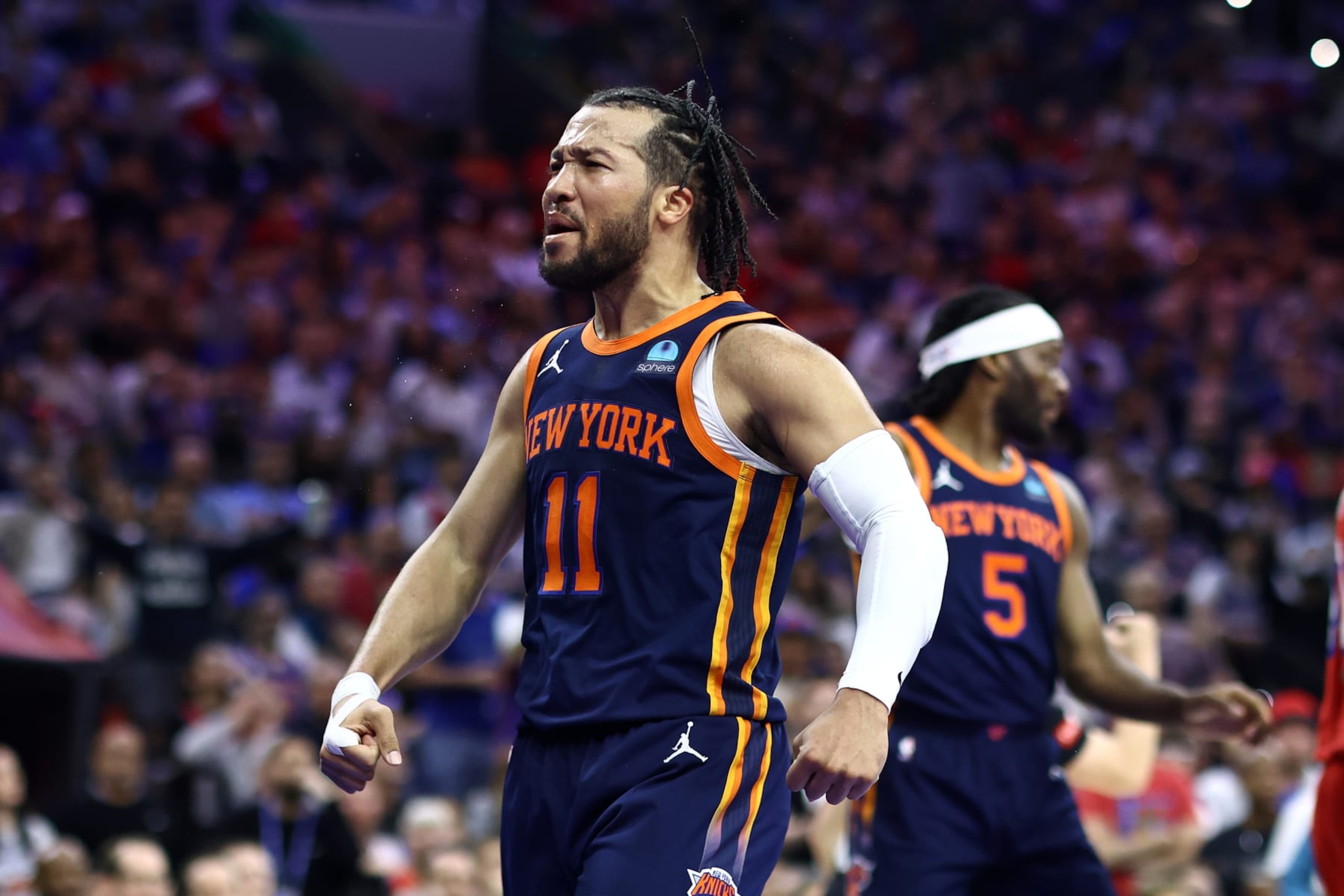 PHILADELPHIA, PENNSYLVANIA - APRIL 28: Jalen Brunson #11 of the New York Knicks reacts during the third quarter against the Philadelphia 76ers during game four of the Eastern Conference First Round Playoffs at the Wells Fargo Center on April 28, 2024 in Philadelphia, Pennsylvania. NOTE TO USER: User expressly acknowledges and agrees that, by downloading and/or using this Photograph, user is consenting to the terms and conditions of the Getty Images License Agreement. (Photo by Tim Nwachukwu/Getty Images)