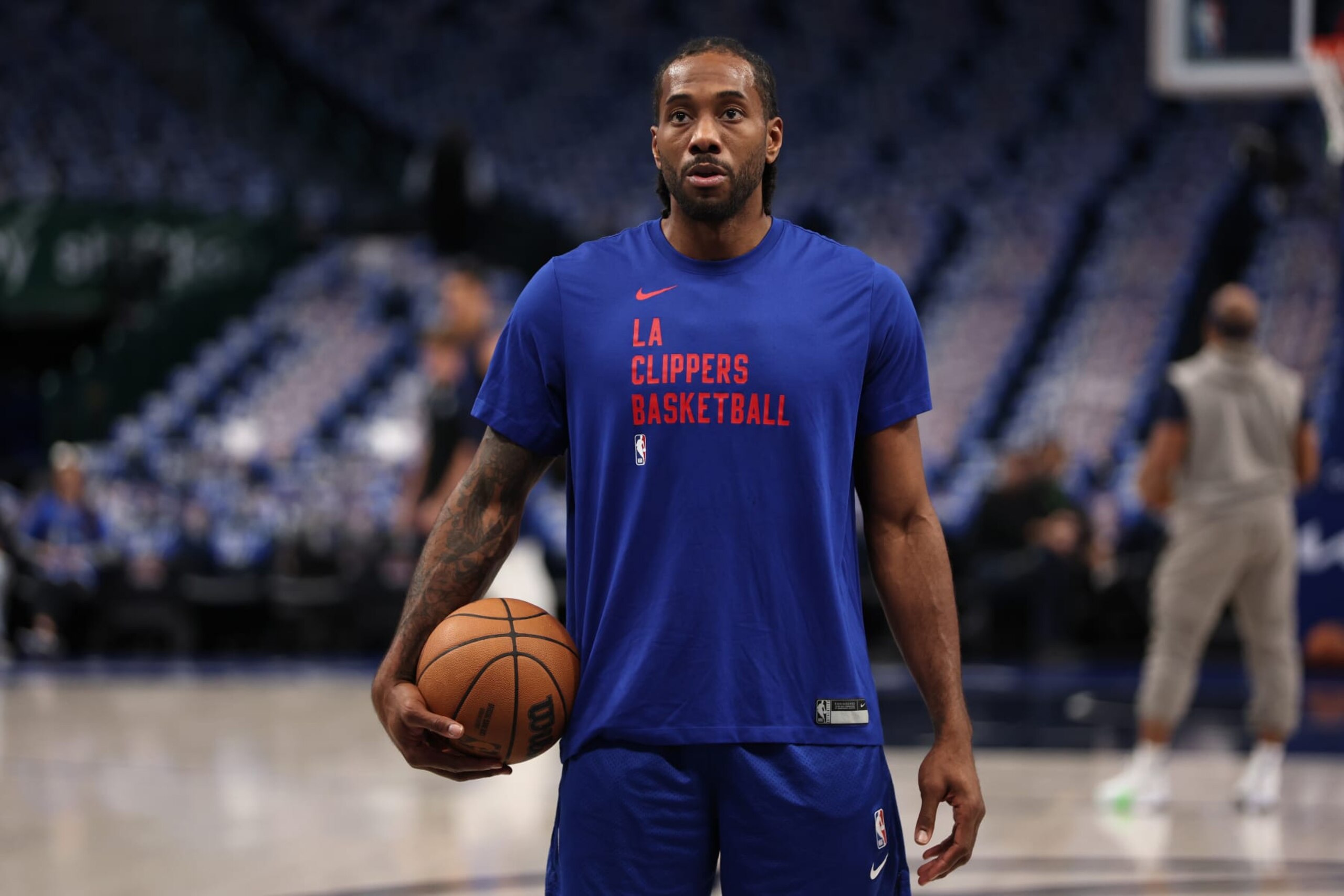 DALLAS, TX - April 26: Kawhi Leonard #2 of the LA Clippers warms up before the game against the Dallas Mavericks during Round 1 Game 3 of the 2024 NBA Playoffs on April 26, 2024 at the American Airlines Center in Dallas, Texas. NOTE TO USER: User expressly acknowledges and agrees that, by downloading and or using this photograph, User is consenting to the terms and conditions of the Getty Images License Agreement. Mandatory Copyright Notice: Copyright 2024 NBAE (Photo by Tim Heitman/NBAE via Getty Images) DALLAS, TX - April 26: Kawhi Leonard #2 of the LA Clippers warms up before the game against the Dallas Mavericks during Round 1 Game 3 of the 2024 NBA Playoffs on April 26, 2024 at the American Airlines Center in Dallas, Texas. NOTE TO USER: User expressly acknowledges and agrees that, by downloading and or using this photograph, User is consenting to the terms and conditions of the Getty Images License Agreement. Mandatory Copyright Notice: Copyright 2024 NBAE (Photo by Tim Heitman/NBAE via Getty Images)