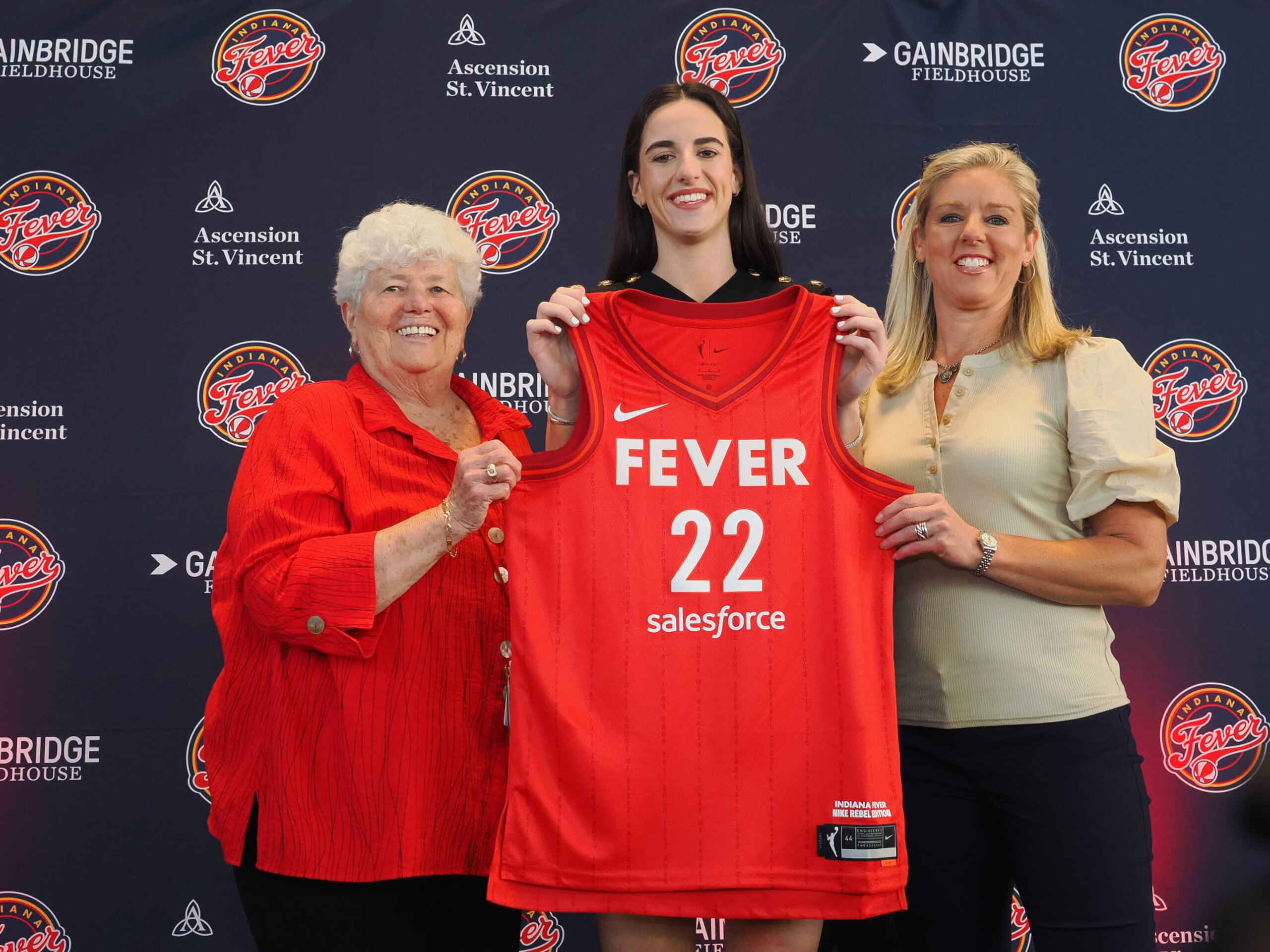 INDIANAPOLIS, IN - APRIL 17: Caitlin Clark of the Indiana Fever poses for a photo with Lin Dunn and Christie Sides during her introductory press conference on April 17, 2024 at Gainbridge Fieldhouse in Indianapolis, Indiana. NOTE TO USER: User expressly acknowledges and agrees that, by downloading and or using this Photograph, user is consenting to the terms and conditions of the Getty Images License Agreement. Mandatory Copyright Notice: Copyright 2024 NBAE (Photo by Ron Hoskins/NBAE via Getty Images)