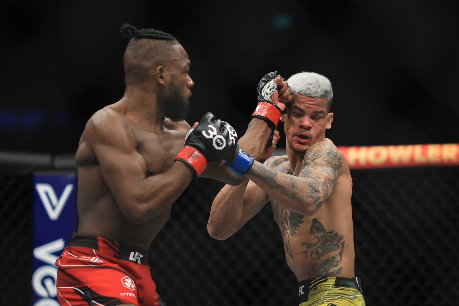 Manel Kape of Portugal trades punches with Felipe Dos Santos