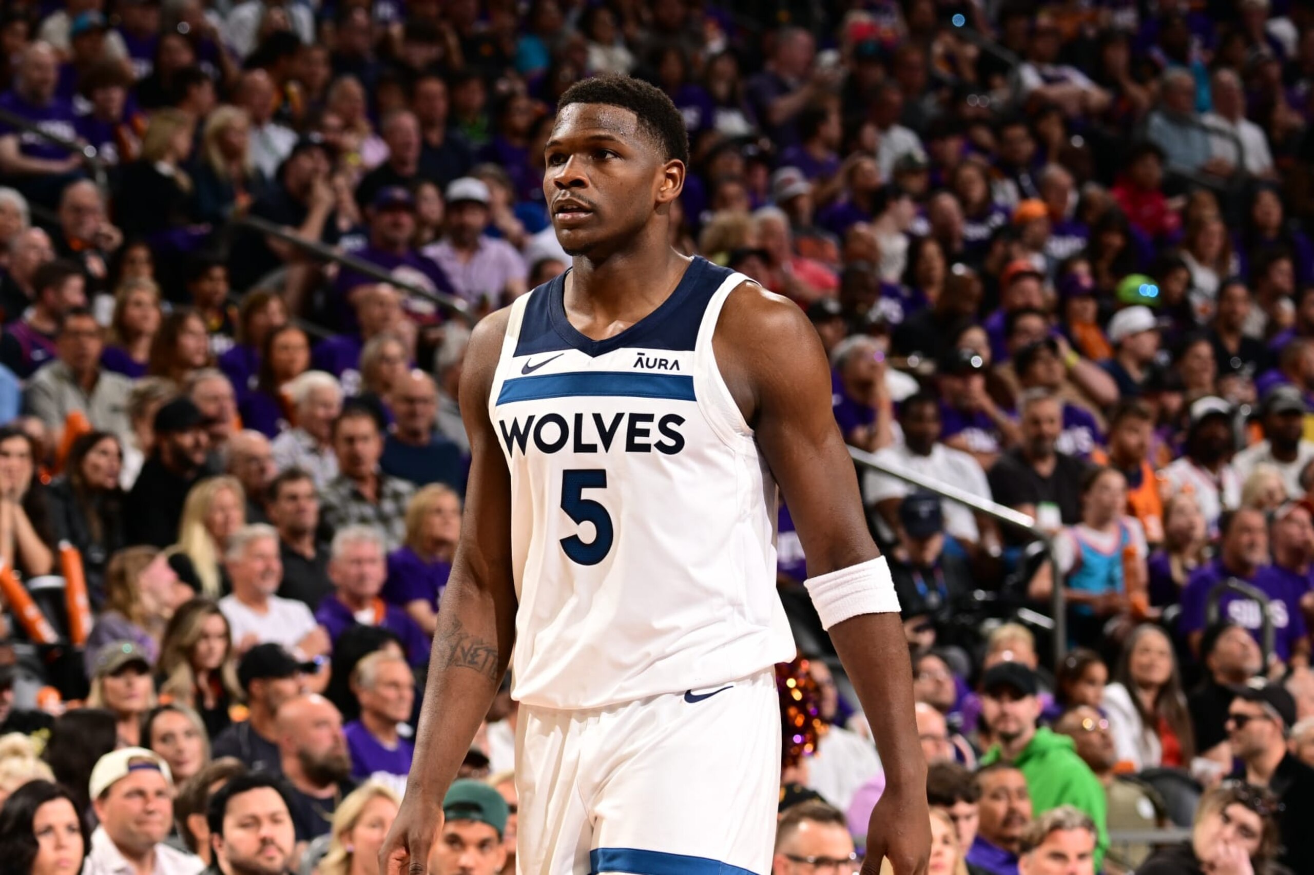 PHOENIX, AZ - APRIL 28: Anthony Edwards #5 of the Minnesota Timberwolves looks on during the game against the Phoenix Suns during Round 1 Game 4 of the 2024 NBA Playoffs on April 28, 2024 at Footprint Center in Phoenix, Arizona. NOTE TO USER: User expressly acknowledges and agrees that, by downloading and or using this photograph, user is consenting to the terms and conditions of the Getty Images License Agreement. Mandatory Copyright Notice: Copyright 2024 NBAE (Photo by Kate Frese/NBAE via Getty Images) PHOENIX, AZ - APRIL 28: Anthony Edwards #5 of the Minnesota Timberwolves looks on during the game against the Phoenix Suns during Round 1 Game 4 of the 2024 NBA Playoffs on April 28, 2024 at Footprint Center in Phoenix, Arizona. NOTE TO USER: User expressly acknowledges and agrees that, by downloading and or using this photograph, user is consenting to the terms and conditions of the Getty Images License Agreement. Mandatory Copyright Notice: Copyright 2024 NBAE (Photo by Kate Frese/NBAE via Getty Images)