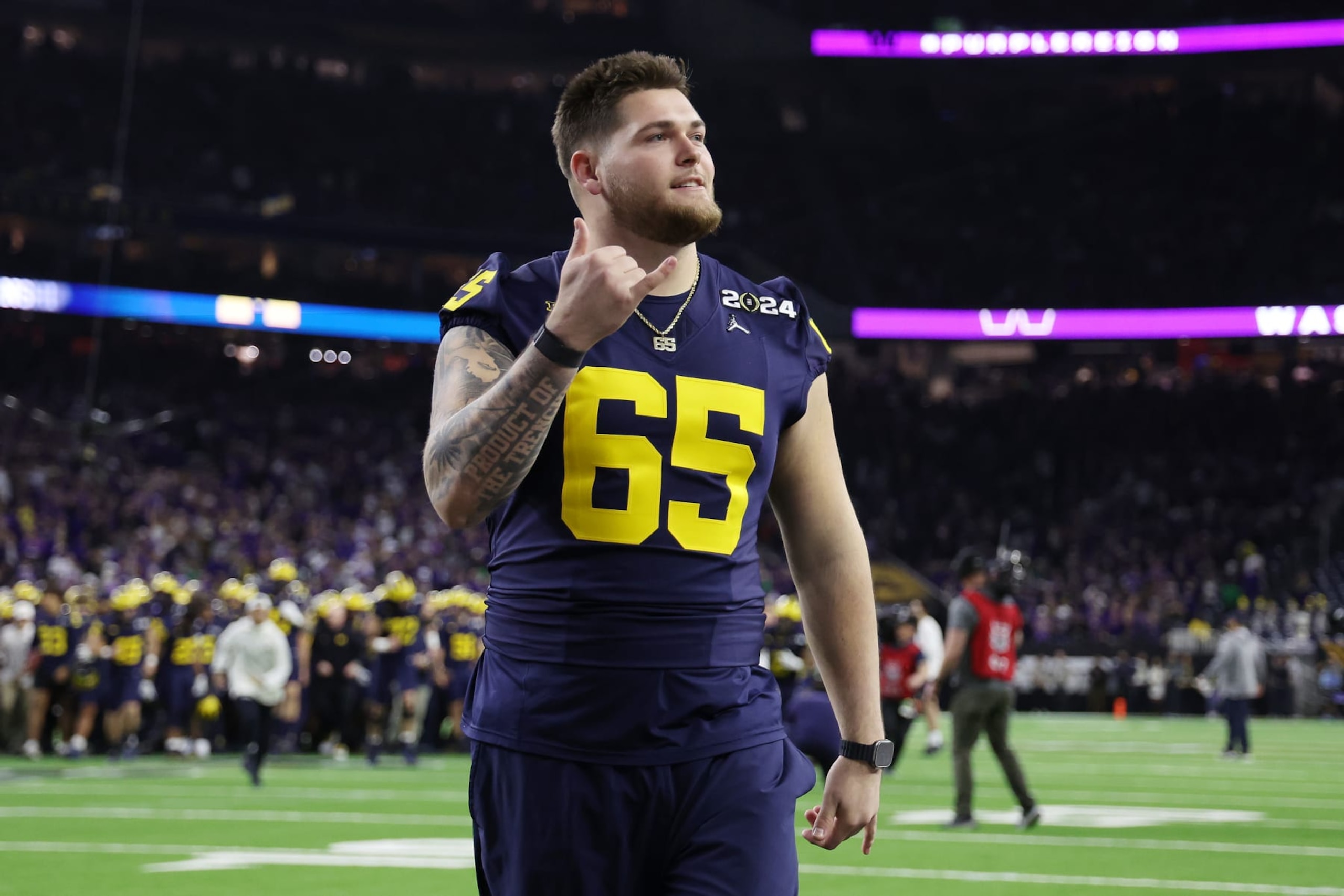 HOUSTON, TEXAS - JANUARY 08: Zak Zinter #65 of the Michigan Wolverines reacts prior to the 2024 CFP National Championship game against the Washington Huskies at NRG Stadium on January 08, 2024 in Houston, Texas. (Photo by Gregory Shamus/Getty Images) HOUSTON, TEXAS - JANUARY 08: Zak Zinter #65 of the Michigan Wolverines reacts prior to the 2024 CFP National Championship game against the Washington Huskies at NRG Stadium on January 08, 2024 in Houston, Texas. (Photo by Gregory Shamus/Getty Images)