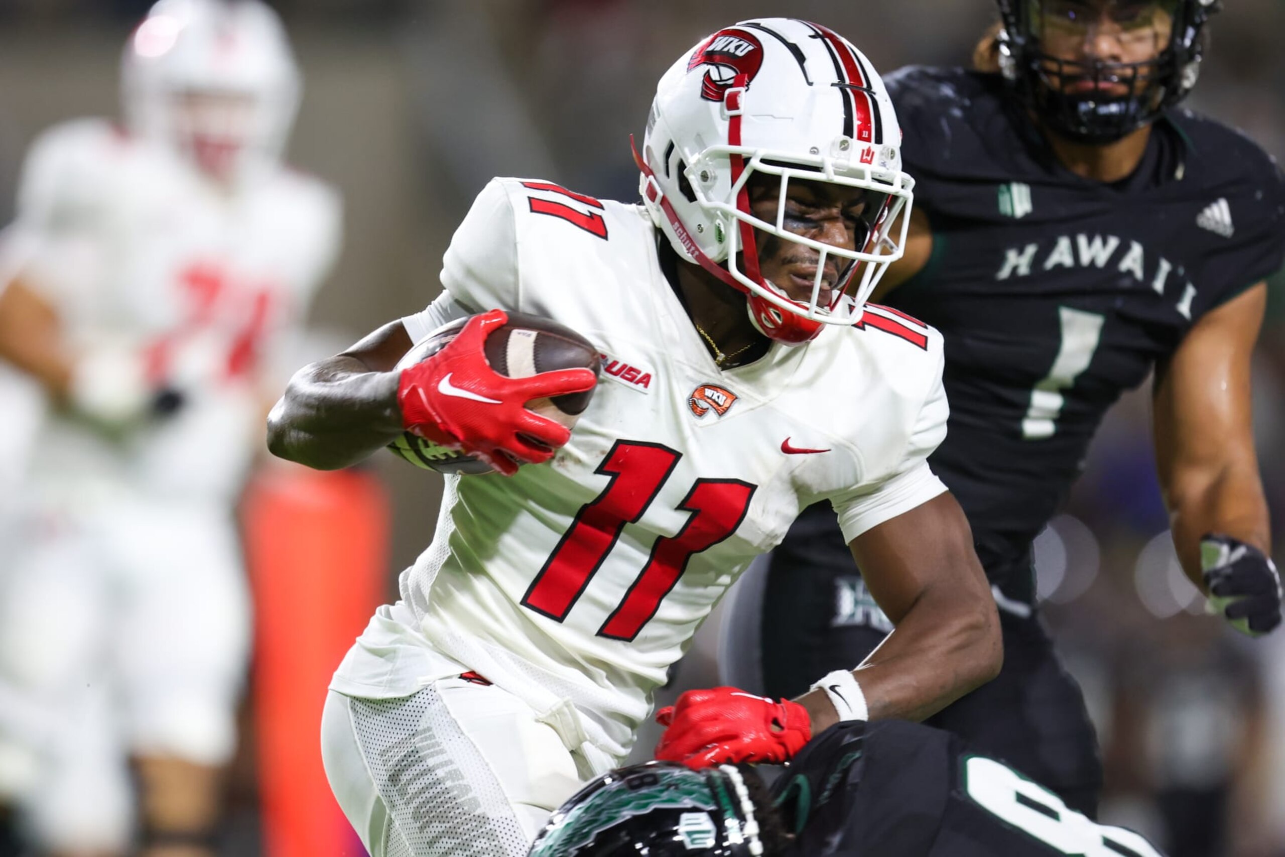 HONOLULU, HI - SEPTEMBER 03: Malachi Corley #11 of the Western Kentucky Hilltoppers runs the ball during the second half of an NCAA football game against the Hawaii Rainbow Warriors at the Clarance T.C. Ching Athletic Complex on September 3, 2022 in Honolulu, Hawaii. (Photo by Darryl Oumi/Getty Images) HONOLULU, HI - SEPTEMBER 03: Malachi Corley #11 of the Western Kentucky Hilltoppers runs the ball during the second half of an NCAA football game against the Hawaii Rainbow Warriors at the Clarance T.C. Ching Athletic Complex on September 3, 2022 in Honolulu, Hawaii. (Photo by Darryl Oumi/Getty Images)
