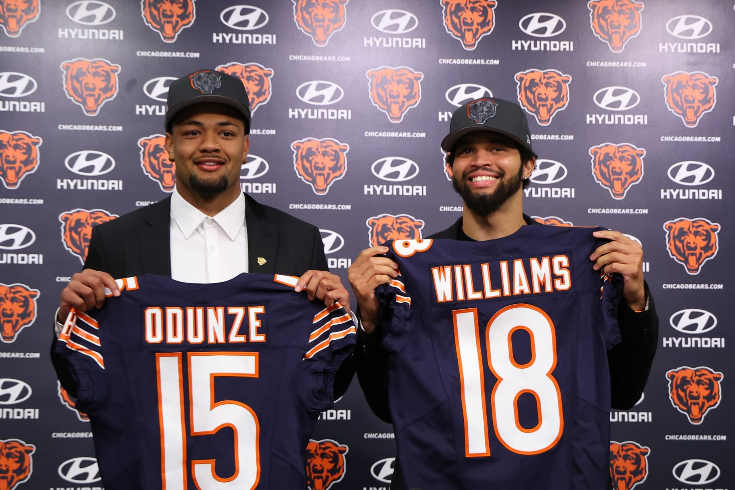 LAKE FOREST, ILLINOIS - APRIL 26: Rome Odunze #15 and Caleb Williams #18 of the Chicago Bears pose for a photo during their introductory press conference at Halas Hall on April 26, 2024 in Lake Forest, Illinois. Caleb Williams was selected first overall and Rome Odunze was selected ninth overall in the first round of the 2024 NFL Draft Thursday. (Photo by Michael Reaves/Getty Images) LAKE FOREST, ILLINOIS - APRIL 26: Rome Odunze #15 and Caleb Williams #18 of the Chicago Bears pose for a photo during their introductory press conference at Halas Hall on April 26, 2024 in Lake Forest, Illinois. Caleb Williams was selected first overall and Rome Odunze was selected ninth overall in the first round of the 2024 NFL Draft Thursday. (Photo by Michael Reaves/Getty Images)