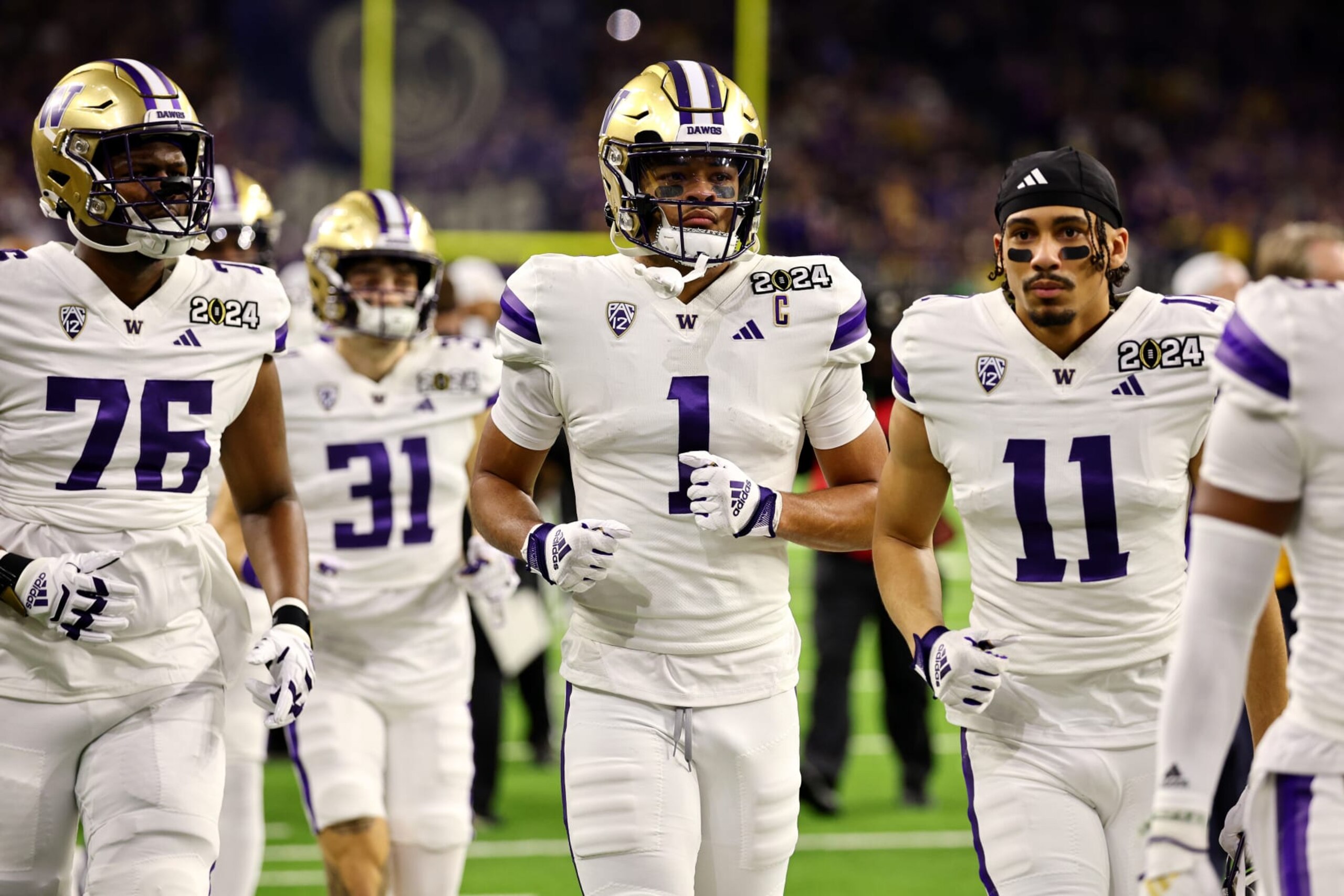 HOUSTON, TEXAS - JANUARY 8: Rome Odunze #1 of the Washington Huskies takes the field against the Michigan Wolverines during the 2024 CFP National Championship game at NRG Stadium on January 8, 2024 in Houston, Texas. (Photo by Jamie Schwaberow/Getty Images) HOUSTON, TEXAS - JANUARY 8: Rome Odunze #1 of the Washington Huskies takes the field against the Michigan Wolverines during the 2024 CFP National Championship game at NRG Stadium on January 8, 2024 in Houston, Texas. (Photo by Jamie Schwaberow/Getty Images)