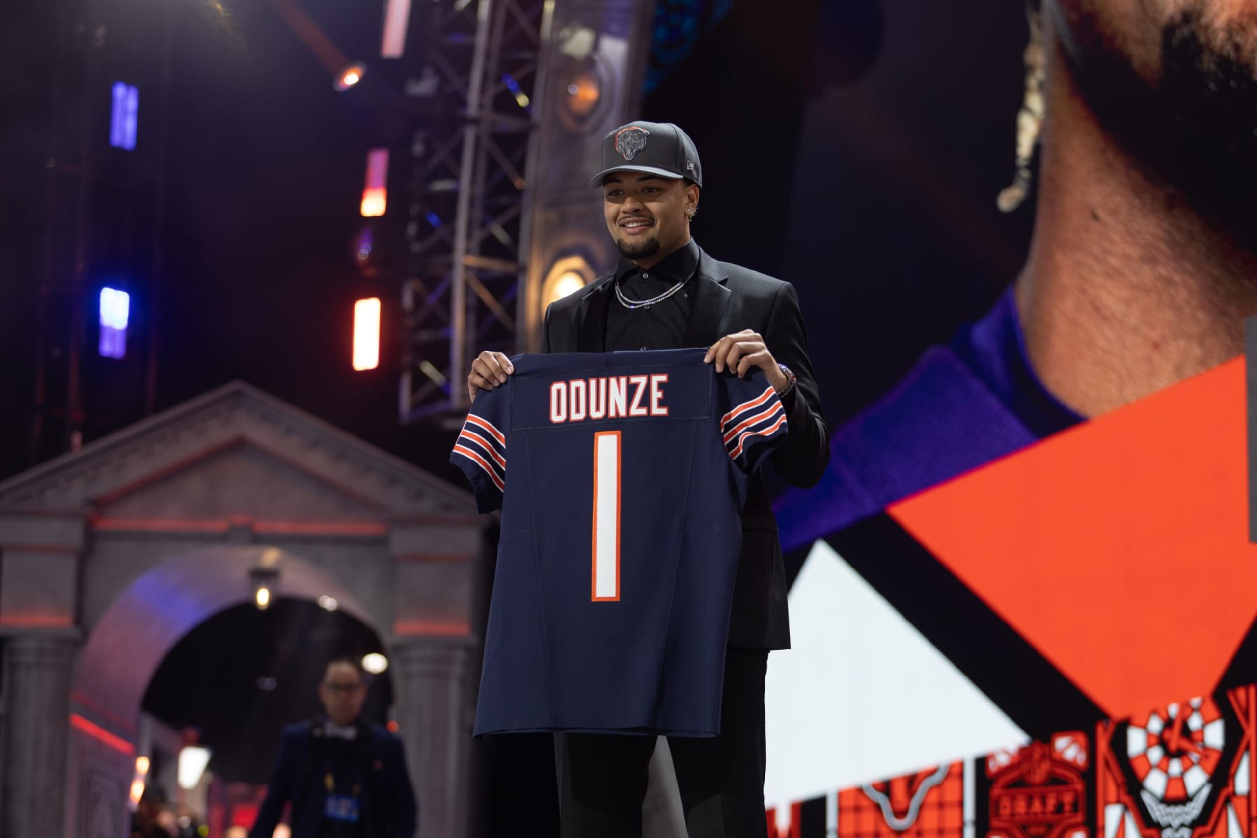 DETROIT, MI - APRIL 25: Washington Wide Receiver Rome Odunze holds a jersey on stage after being taken ninth overall by the Chicago Bears during Day 1 of the NFL Draft on April 25, 2024 at Campus Martius Park and Hart Plaza in Detroit, MI. (Photo by John Smolek/Icon Sportswire via Getty Images) DETROIT, MI - APRIL 25: Washington Wide Receiver Rome Odunze holds a jersey on stage after being taken ninth overall by the Chicago Bears during Day 1 of the NFL Draft on April 25, 2024 at Campus Martius Park and Hart Plaza in Detroit, MI. (Photo by John Smolek/Icon Sportswire via Getty Images)