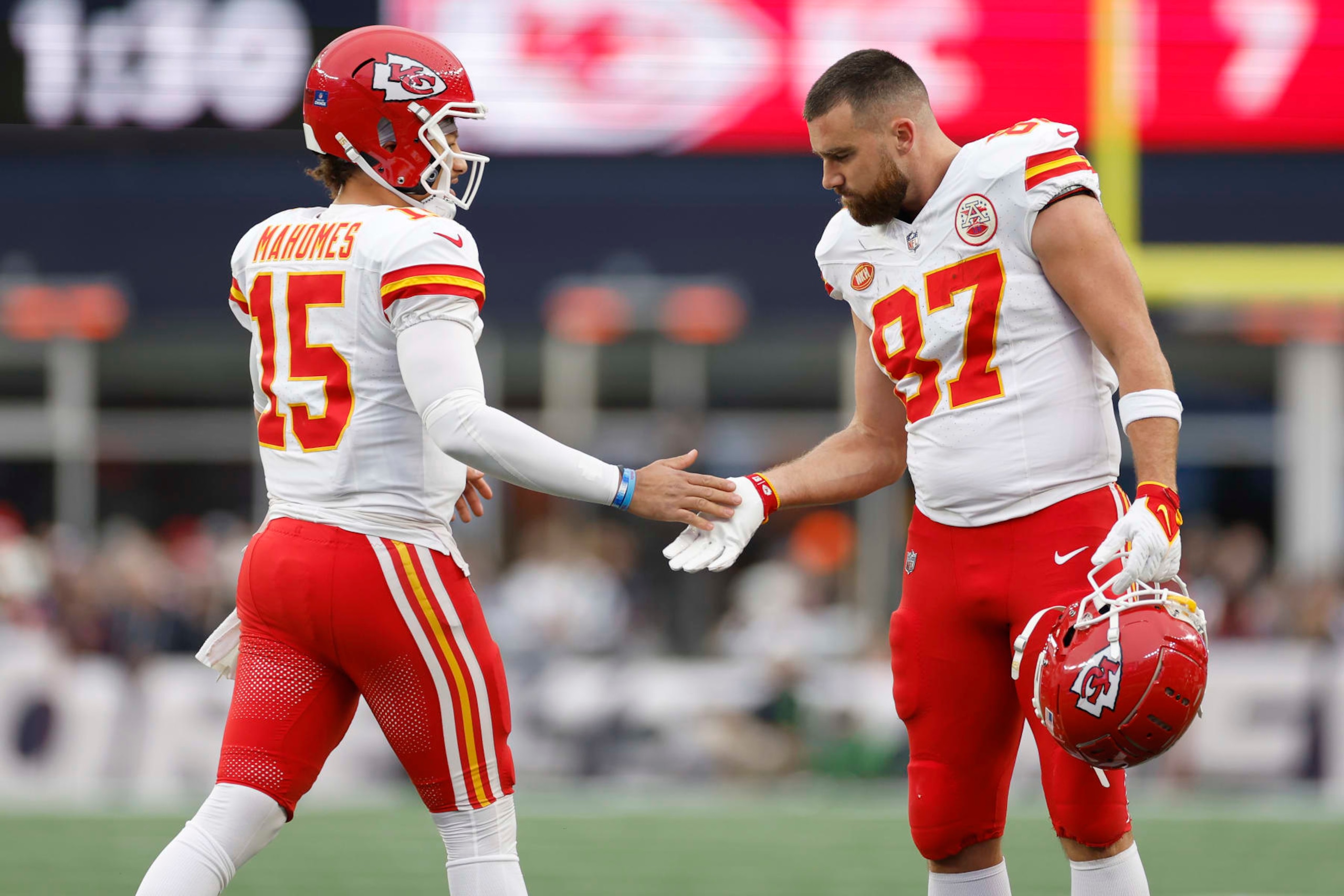 FOXBOROUGH, MASSACHUSETTS - DECEMBER 17: Patrick Mahomes #15 and Travis Kelce #87 of the Kansas City Chiefs high five during the first half against the New England Patriots at Gillette Stadium on December 17, 2023 in Foxborough, Massachusetts. (Photo by Sarah Stier/Getty Images) FOXBOROUGH, MASSACHUSETTS - DECEMBER 17: Patrick Mahomes #15 and Travis Kelce #87 of the Kansas City Chiefs high five during the first half against the New England Patriots at Gillette Stadium on December 17, 2023 in Foxborough, Massachusetts. (Photo by Sarah Stier/Getty Images)